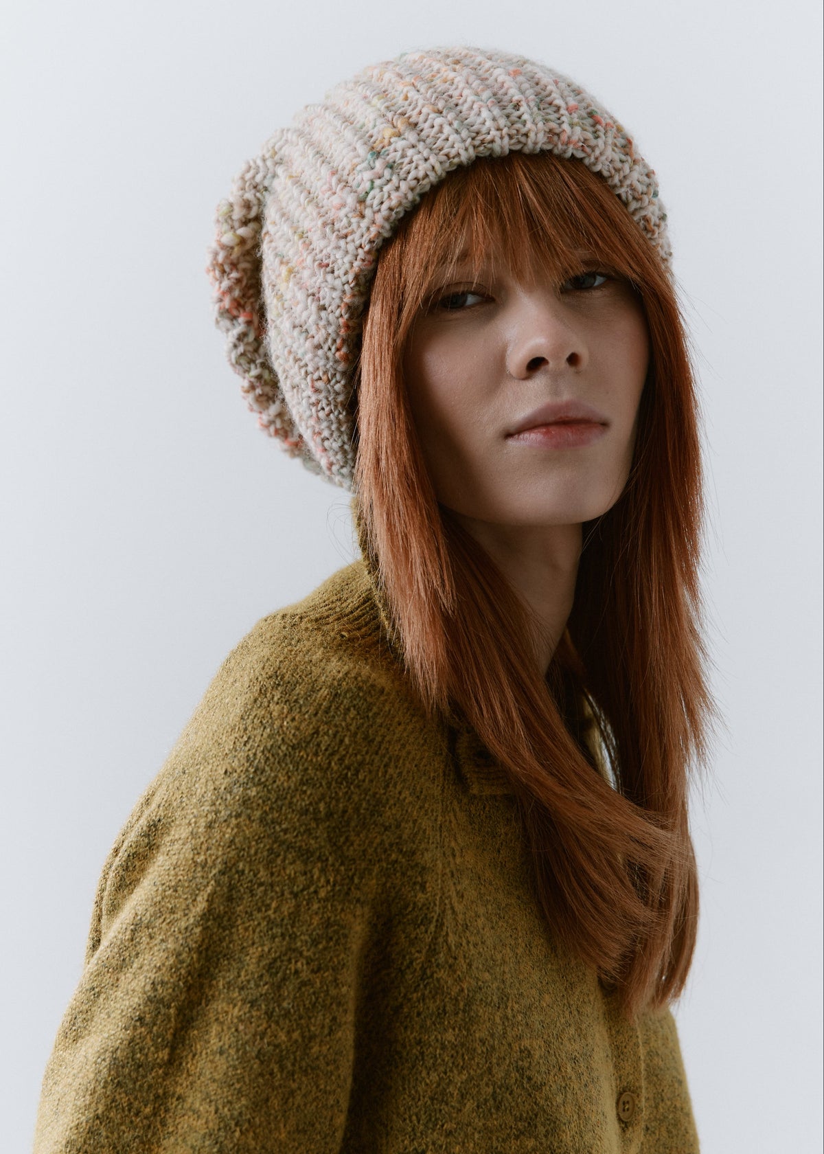 London Snowdrop knit beanie: Three-quarter portrait with brim turned up