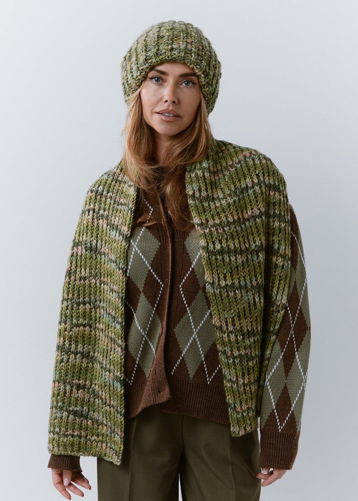 BRIKOLY Apple green oversized knit beanie worn by a model with a matching scarf hanging down the front.