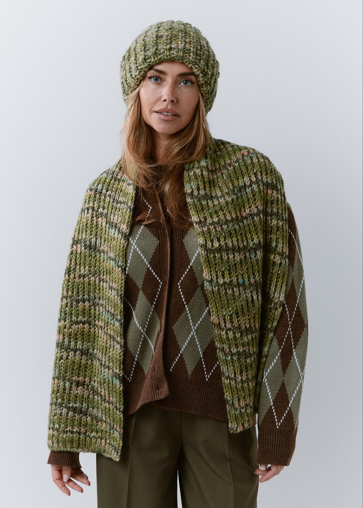 BRIKOLY Apple green multicolor ribbed knit scarf worn unwrapped with both ends hanging down the front.