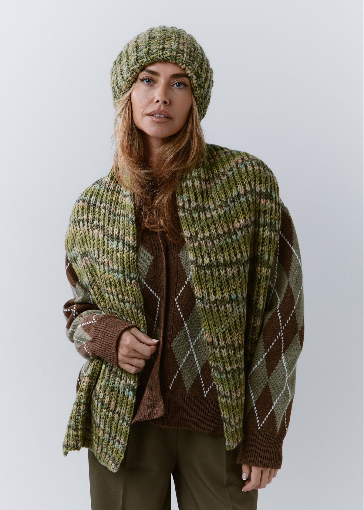 BRIKOLY Apple green multicolor ribbed knit scarf draped over a model's shoulders with both ends hanging in front.