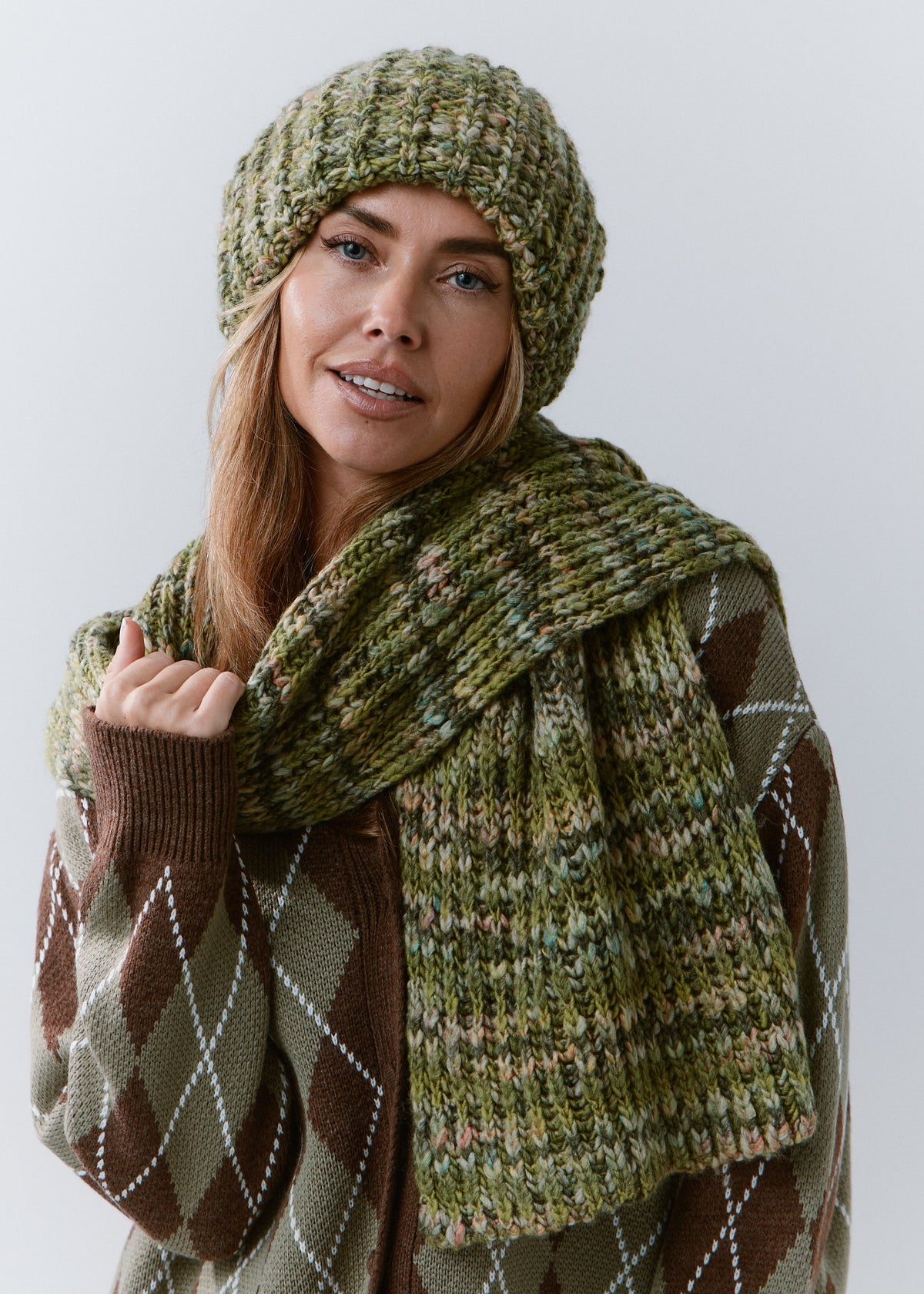 BRIKOLY Apple green oversized knit beanie shown on a model with a matching scarf wrapped around her neck.