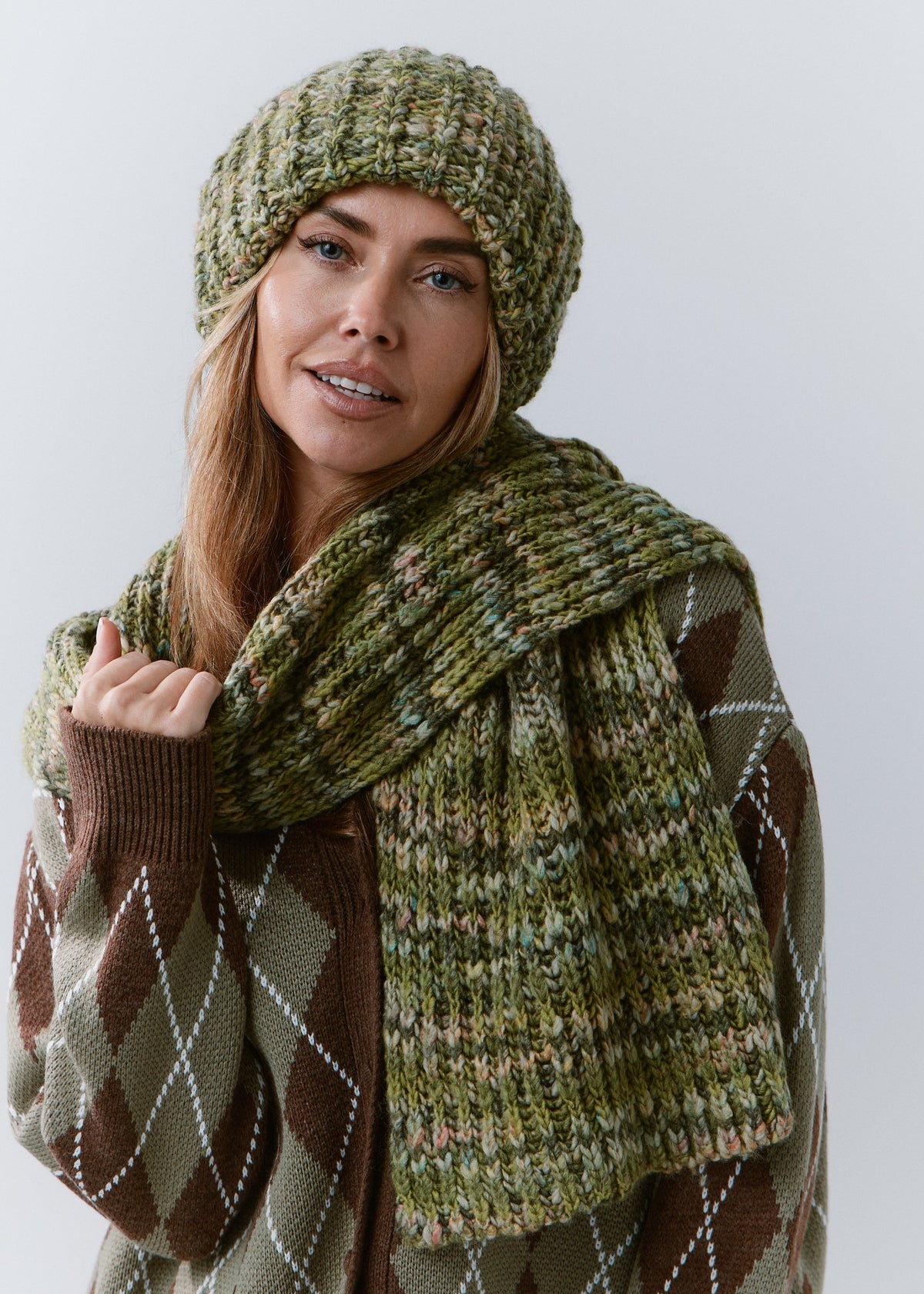 BRIKOLY Apple green multicolor ribbed knit scarf wrapped around a model's neck with one wide end hanging in front.