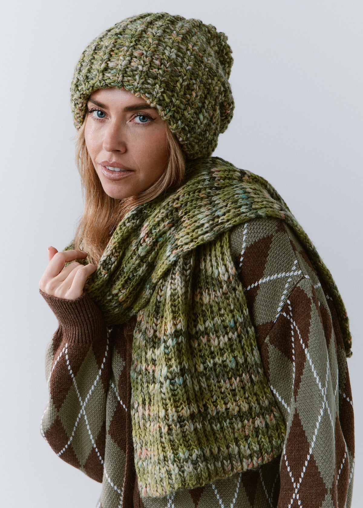 BRIKOLY Apple green oversized knit beanie worn by a model in a side view with a matching scarf.