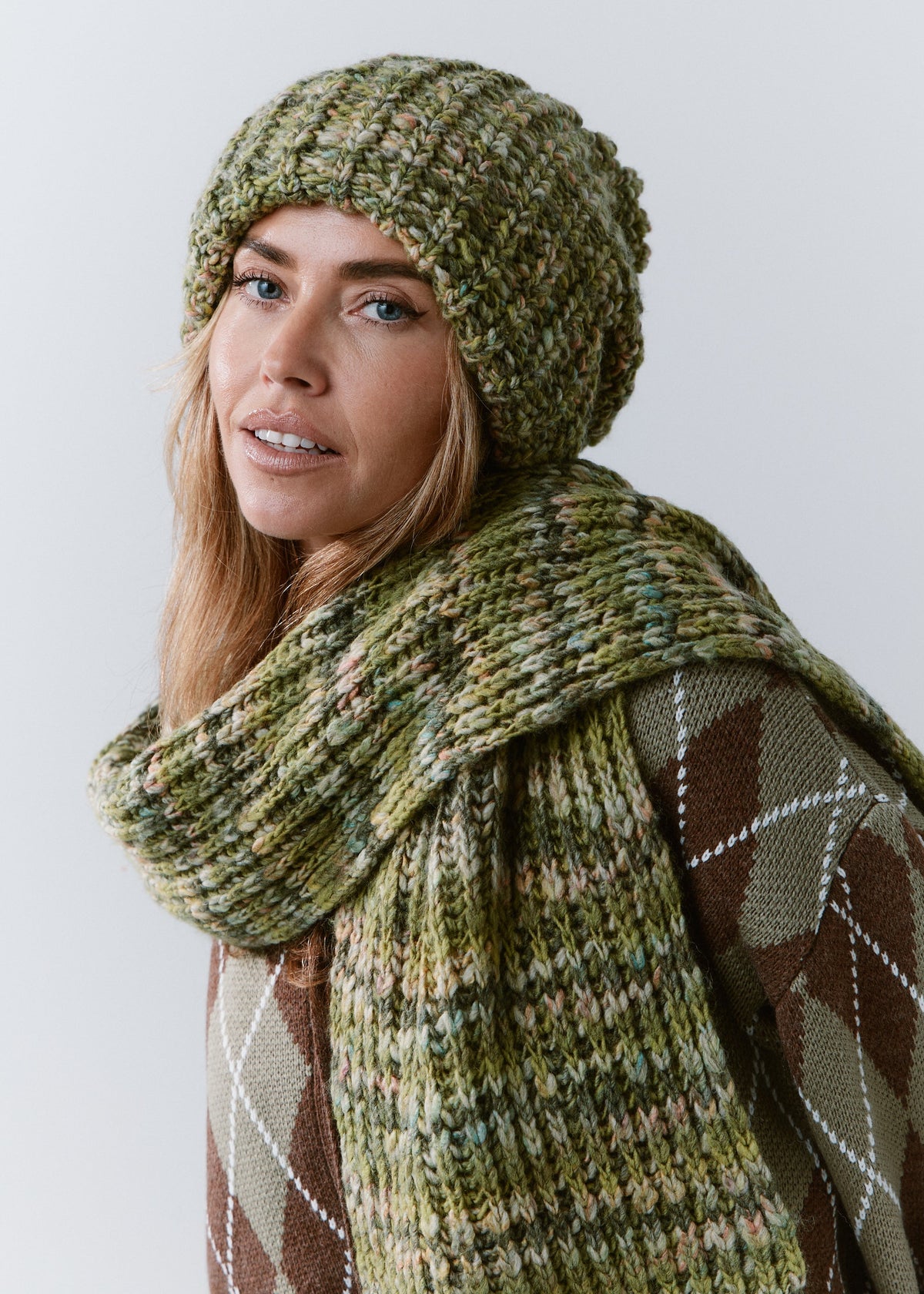 BRIKOLY Apple green multicolor ribbed knit scarf wrapped across a model's shoulders in a side view.