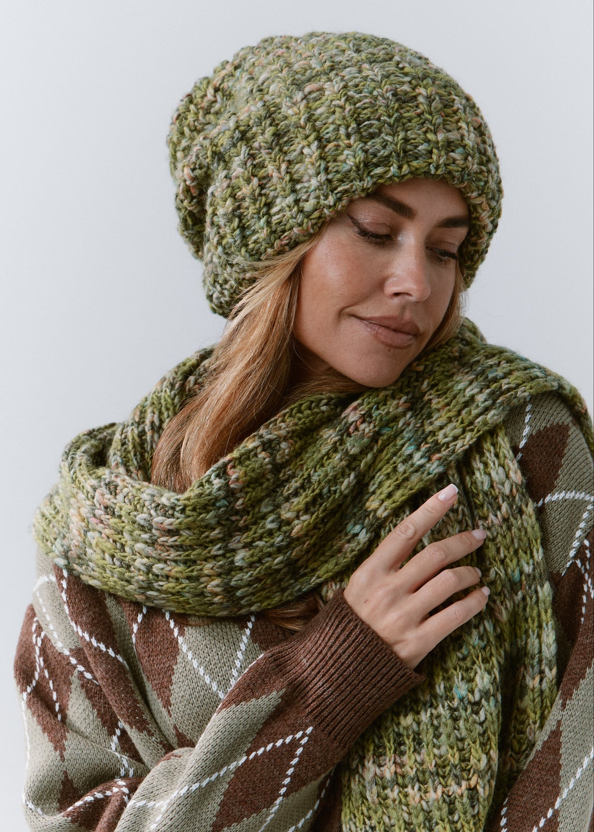 BRIKOLY Apple green multicolor ribbed knit scarf shown close up on a model looking down at the ribbed knit.