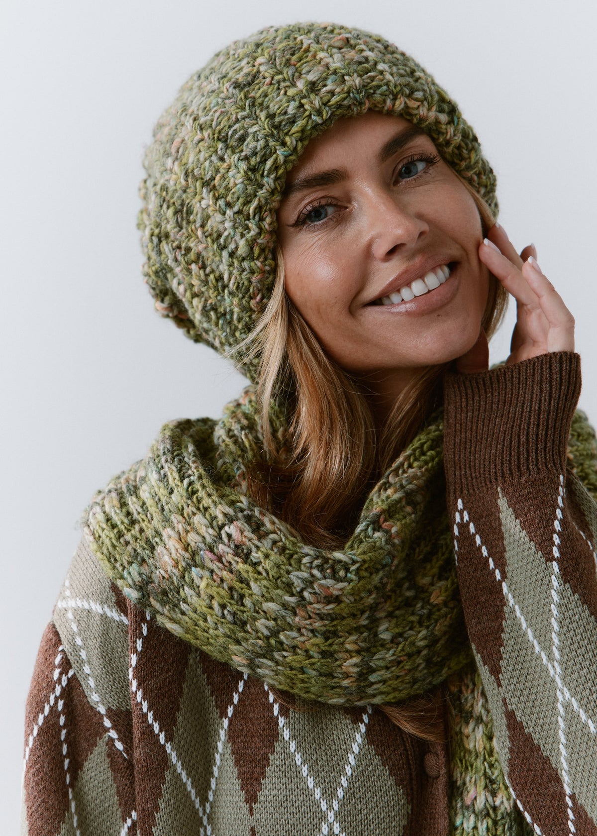 BRIKOLY Apple green multicolor ribbed knit scarf wrapped around a smiling model's neck.