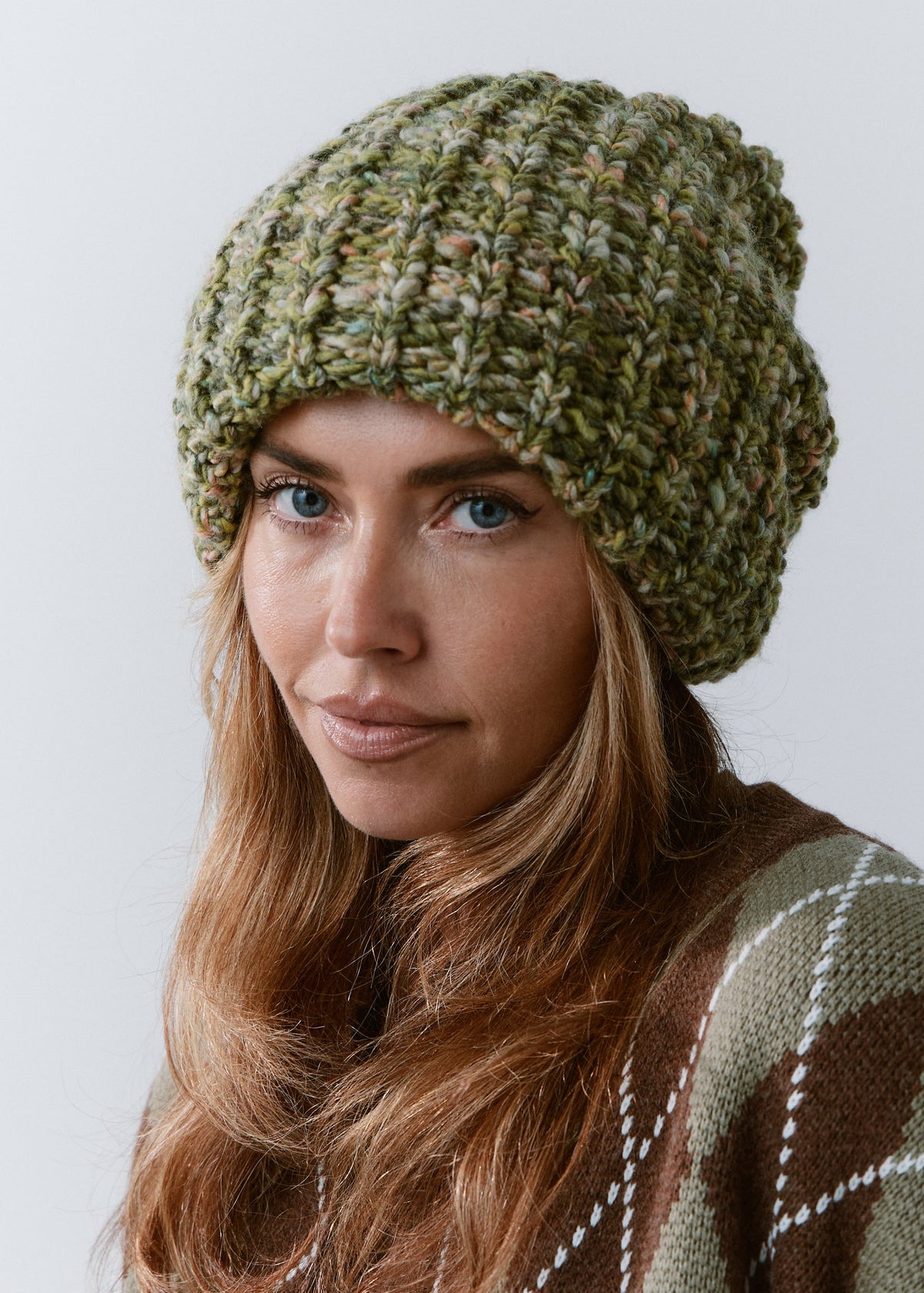 BRIKOLY Apple green oversized knit beanie worn by a model in a close front view.
