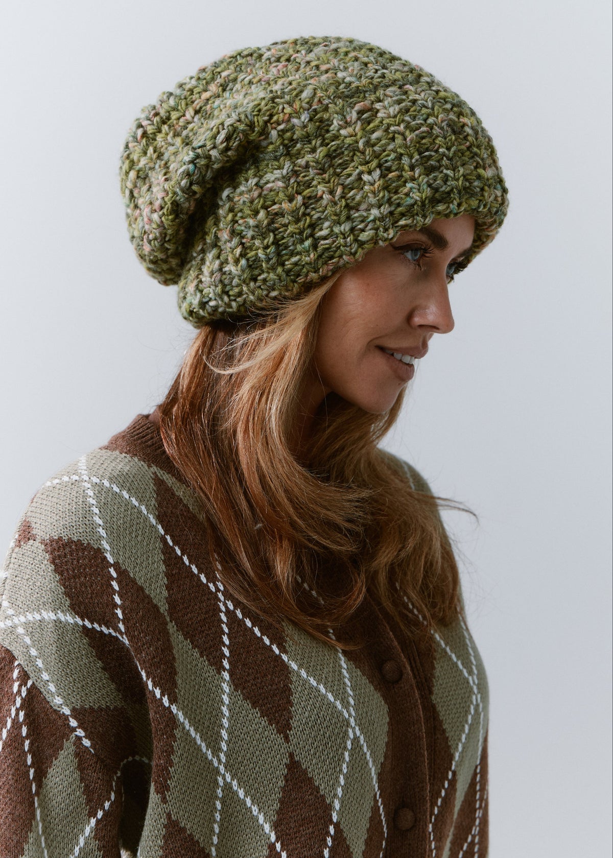 BRIKOLY Apple green oversized knit beanie shown in a side view to reveal its slouchy crown.
