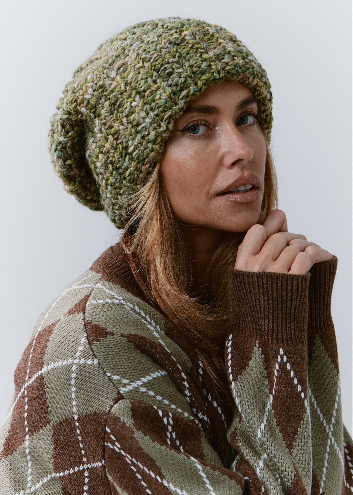 BRIKOLY Apple green oversized knit beanie worn by a model looking toward the camera.