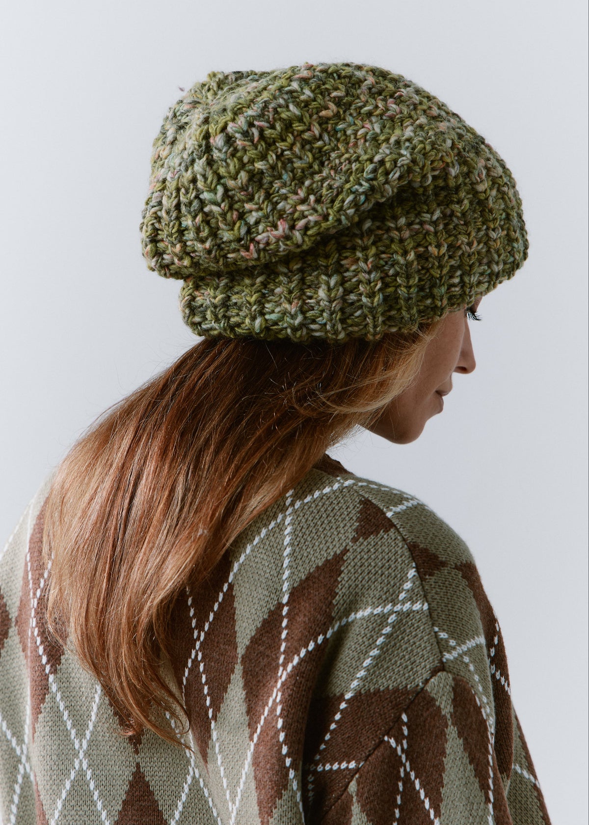 BRIKOLY Apple green oversized knit beanie shown from the rear side to reveal its relaxed shape.