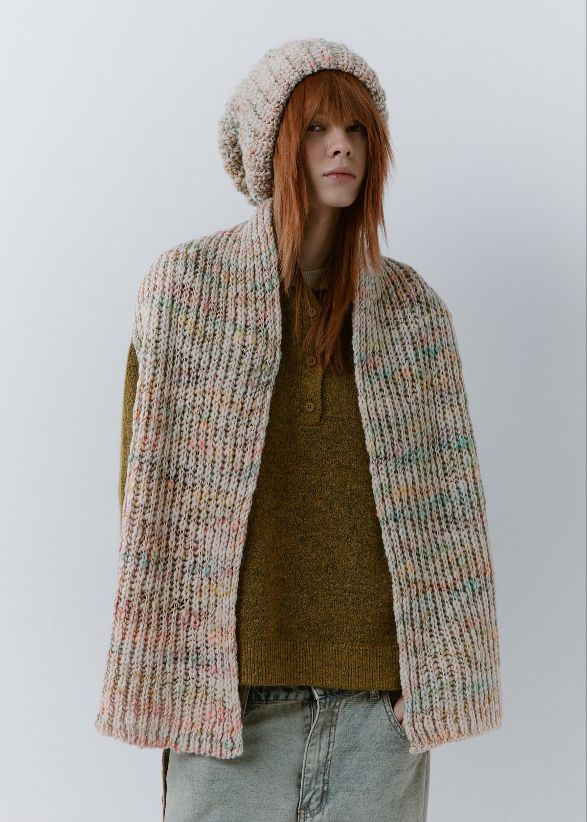 BRIKOLY Snowdrop pale multicolor oversized knit beanie worn by a model with a matching scarf hanging down the front.