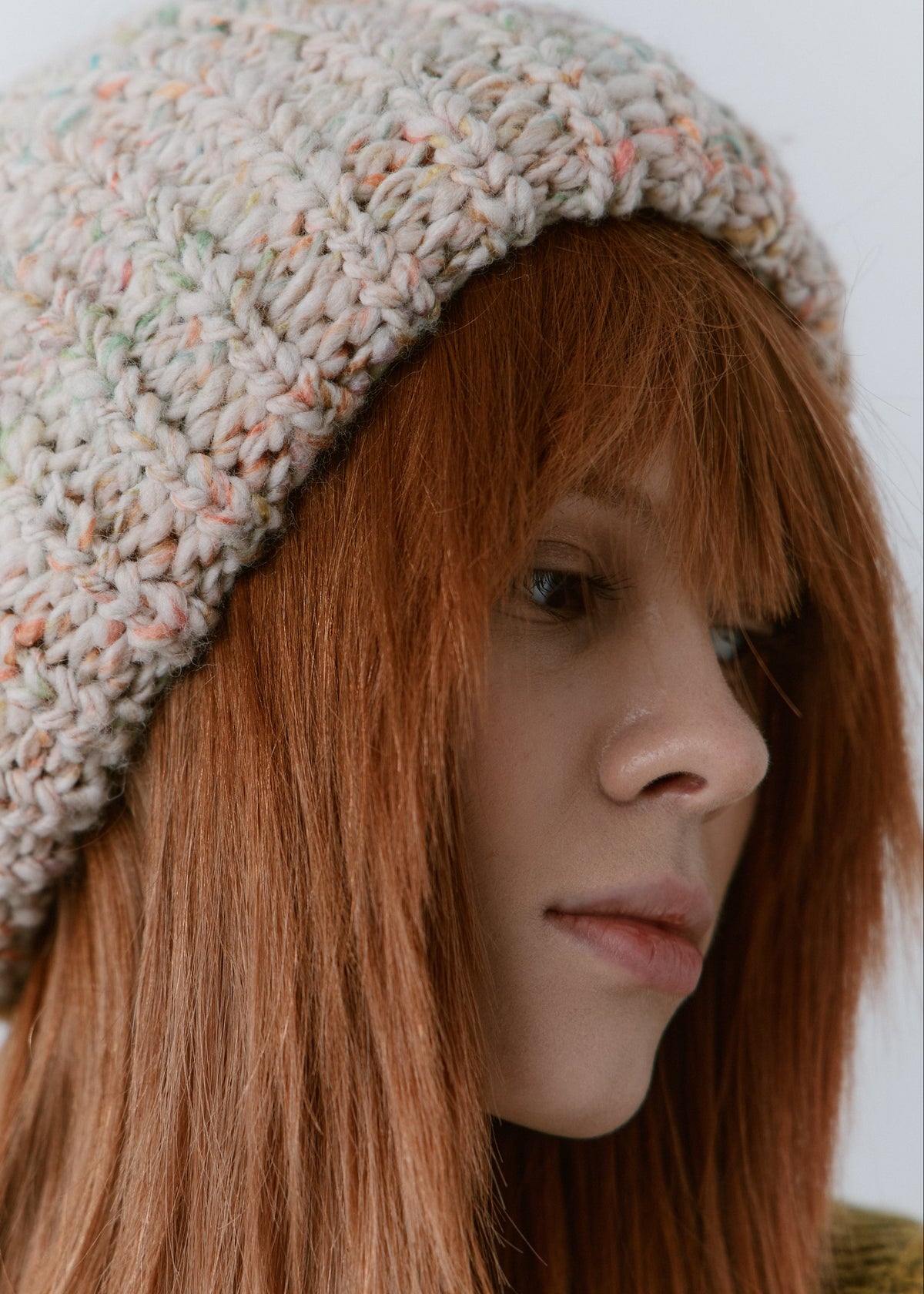 BRIKOLY Snowdrop pale multicolor oversized knit beanie shown close up to reveal the pale multicolor chunky knit and folded brim.