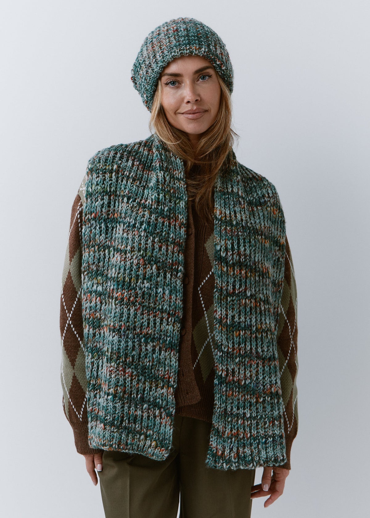 London Green and Orange knit beanie: Full outfit view with matching scarf draped over shoulders, sold separately