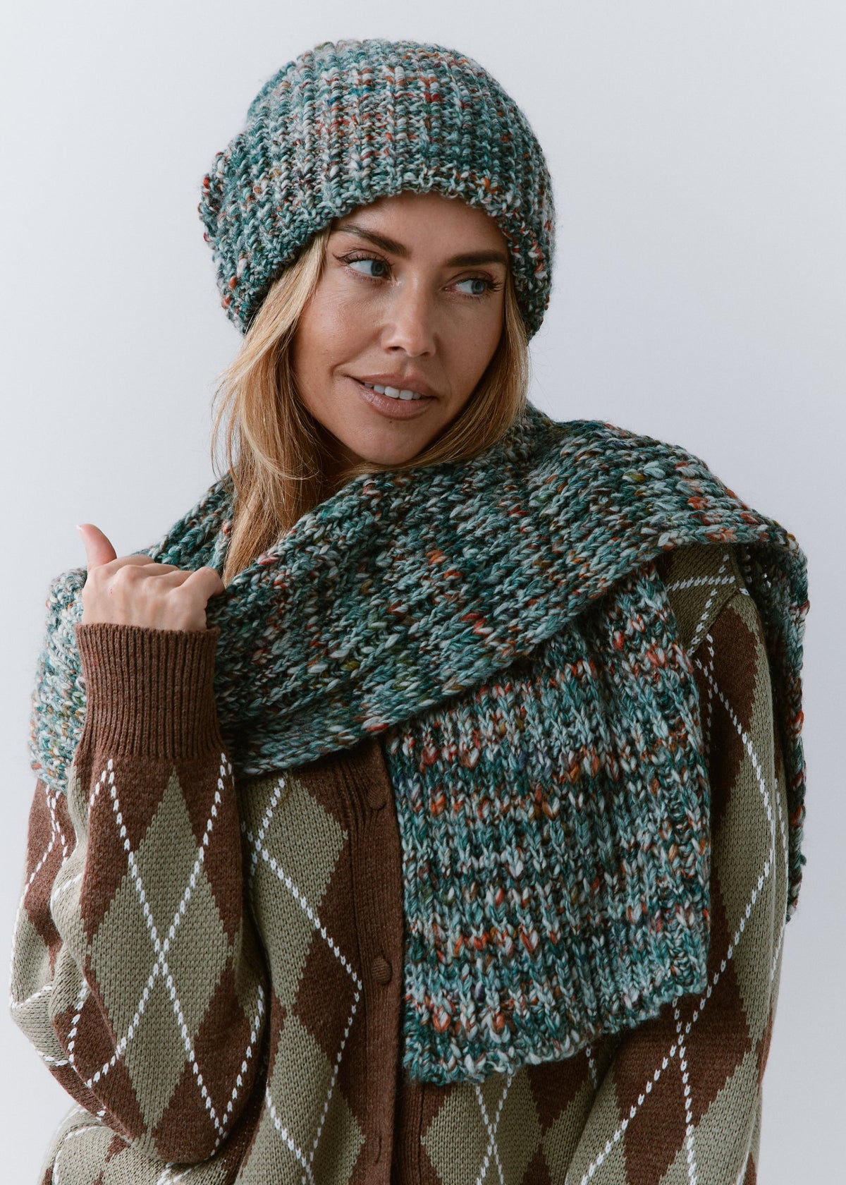 London Green and Orange knit beanie: Front portrait with matching scarf wrapped at the neck, sold separately