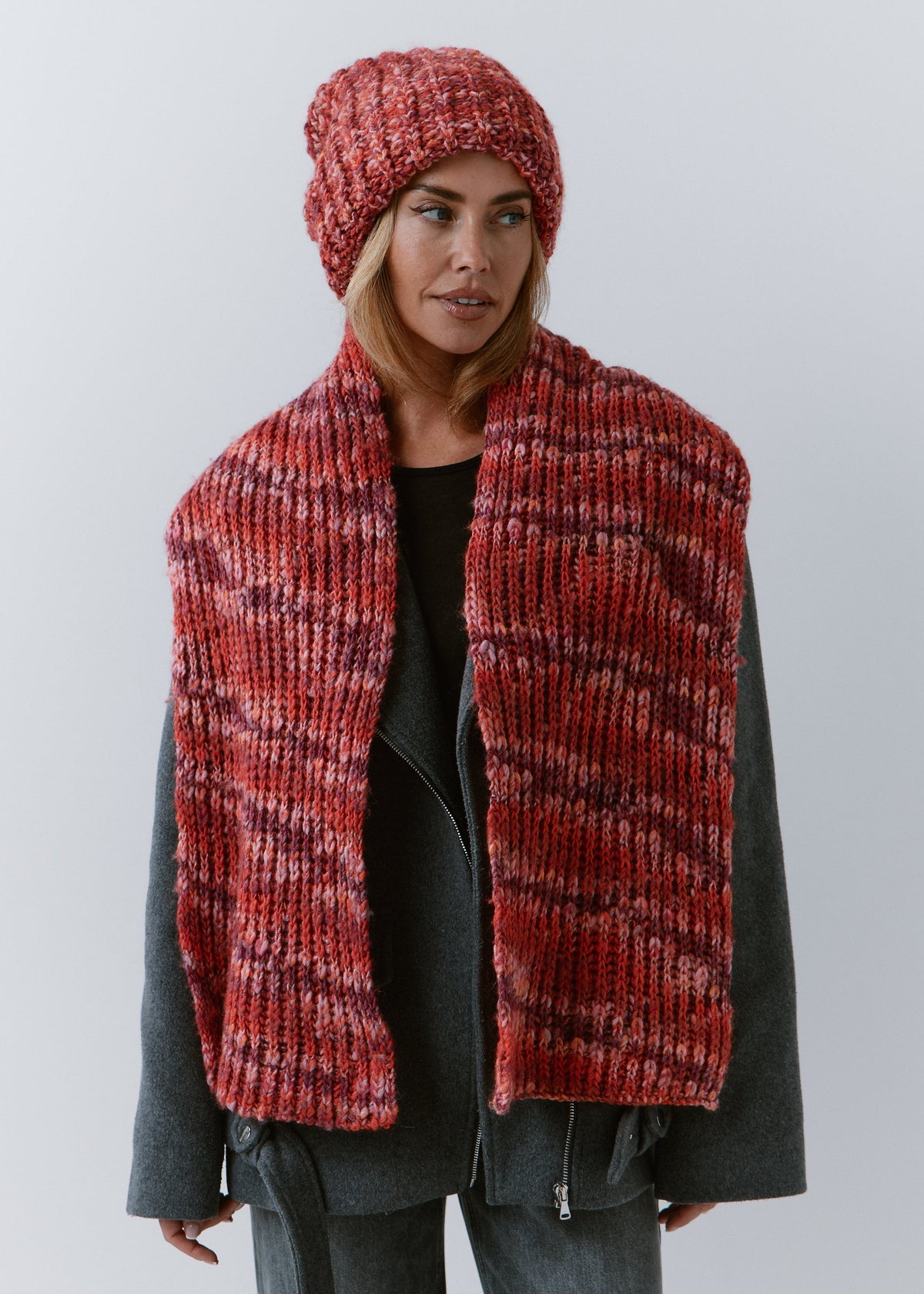 BRIKOLY Red oversized multicolor knit beanie worn by a model with a matching scarf hanging down the front.