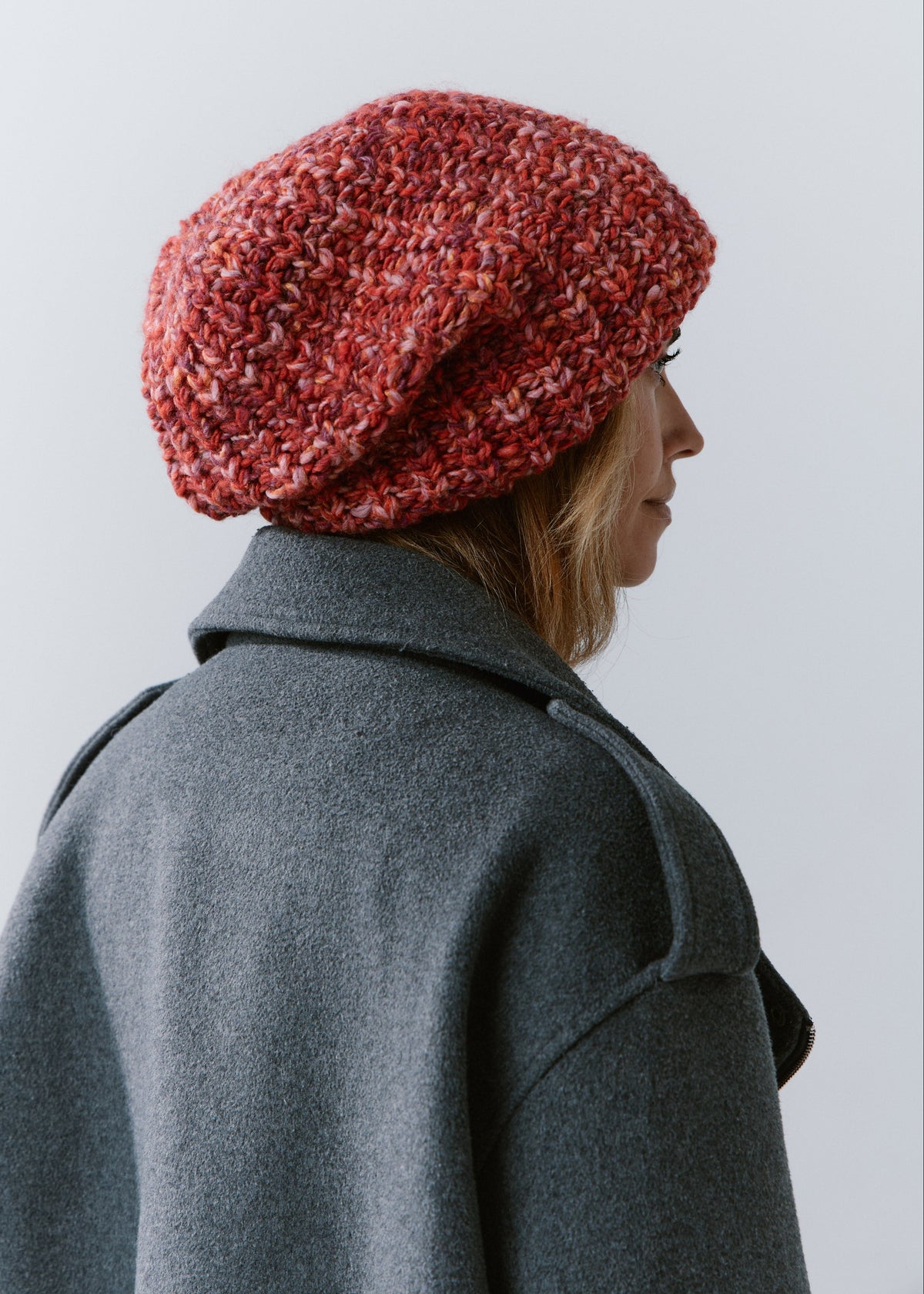 BRIKOLY Red oversized multicolor knit beanie shown from the rear side to reveal its slouchy crown.