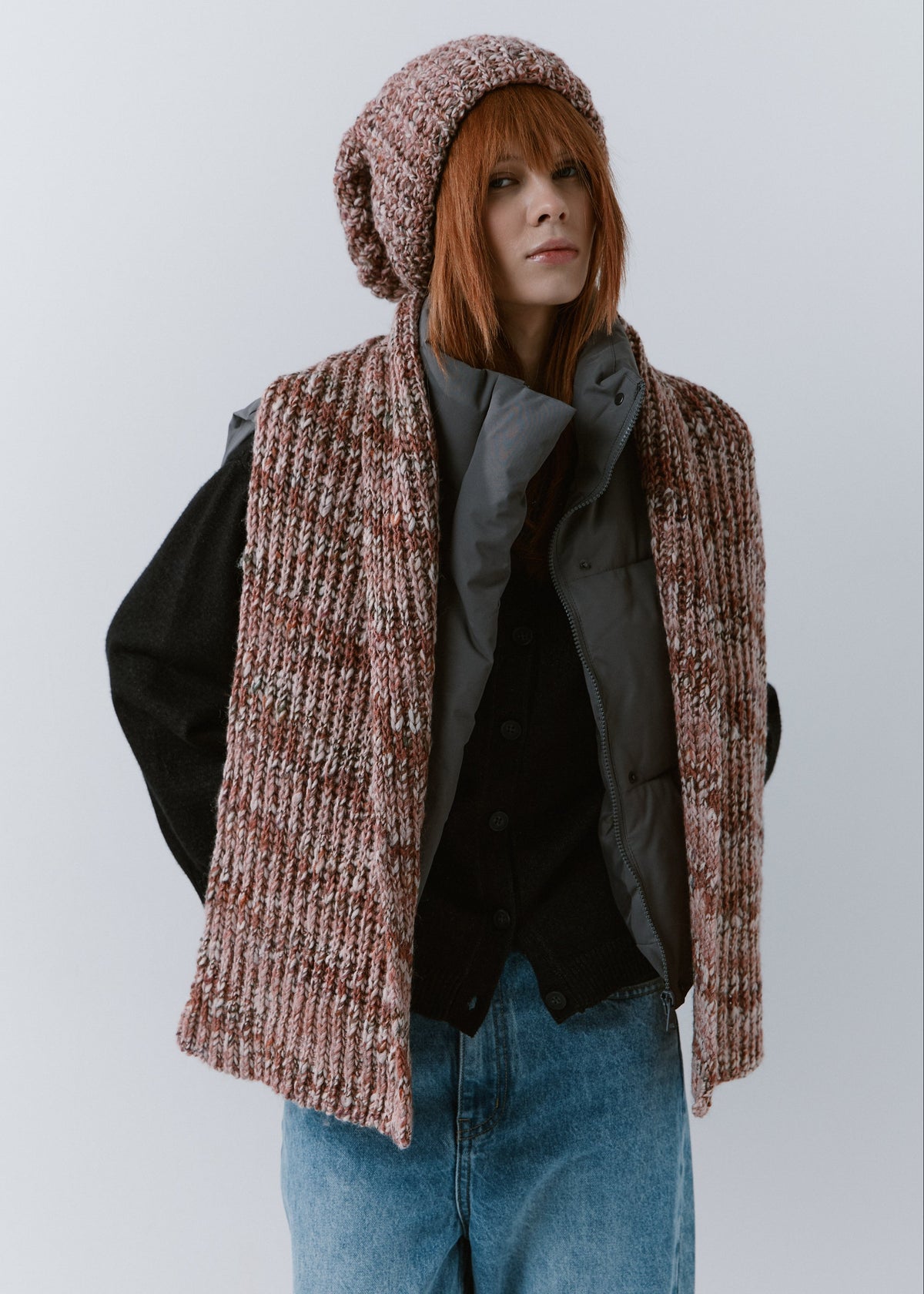 BRIKOLY Rose oversized multicolor knit beanie worn by a model with a matching scarf draped down the front.