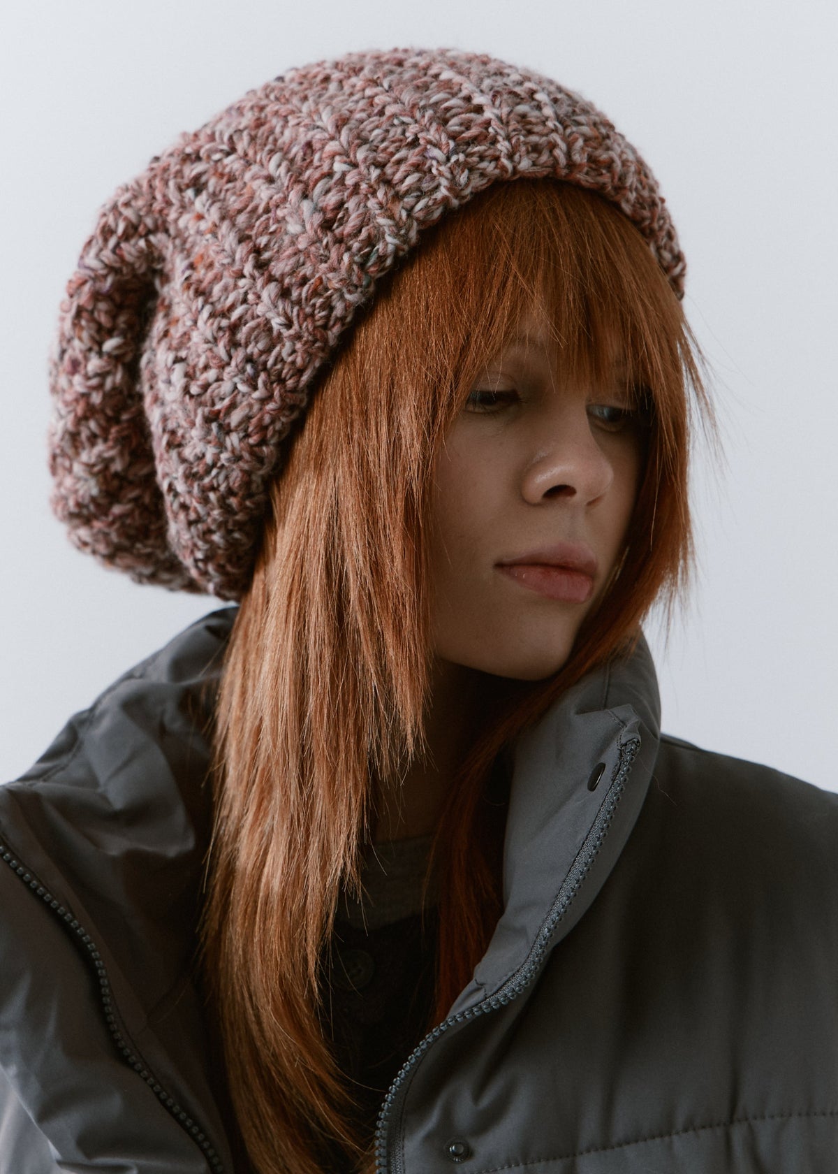 BRIKOLY Rose oversized multicolor knit beanie worn by a model in a close three-quarter view.