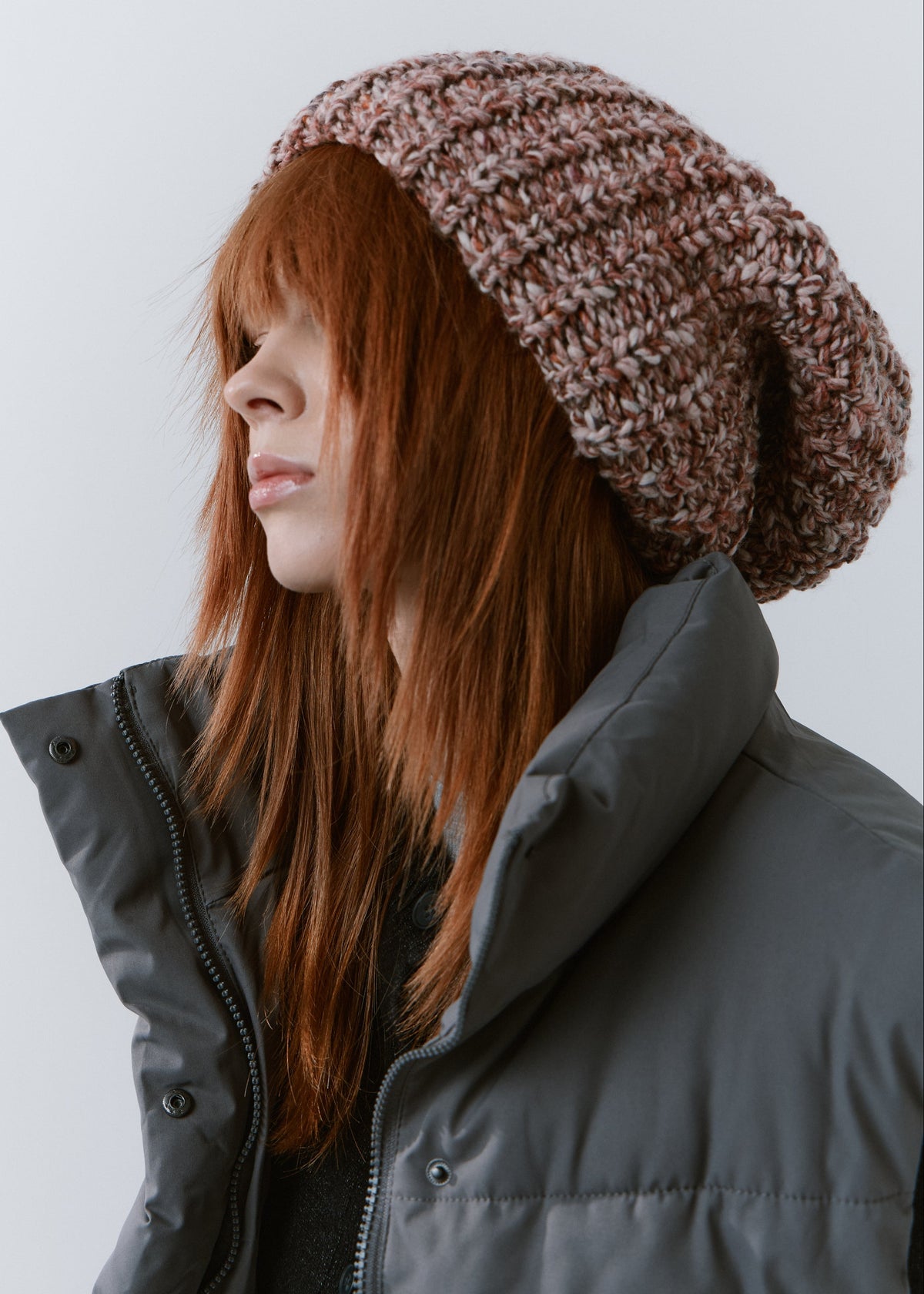 BRIKOLY Rose oversized multicolor knit beanie shown in profile with a folded brim and relaxed crown.