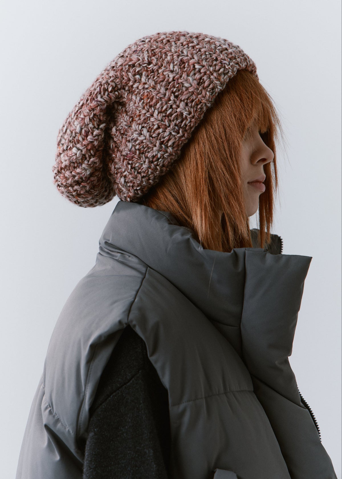 BRIKOLY Rose oversized multicolor knit beanie worn by a model in a side view.