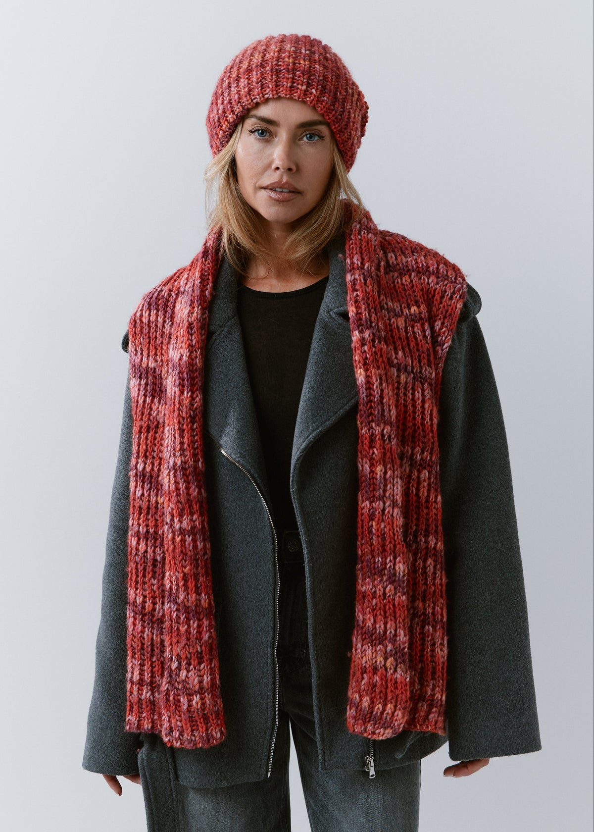 London Red knit beanie: Full outfit view with matching scarf draped over shoulders, sold separately