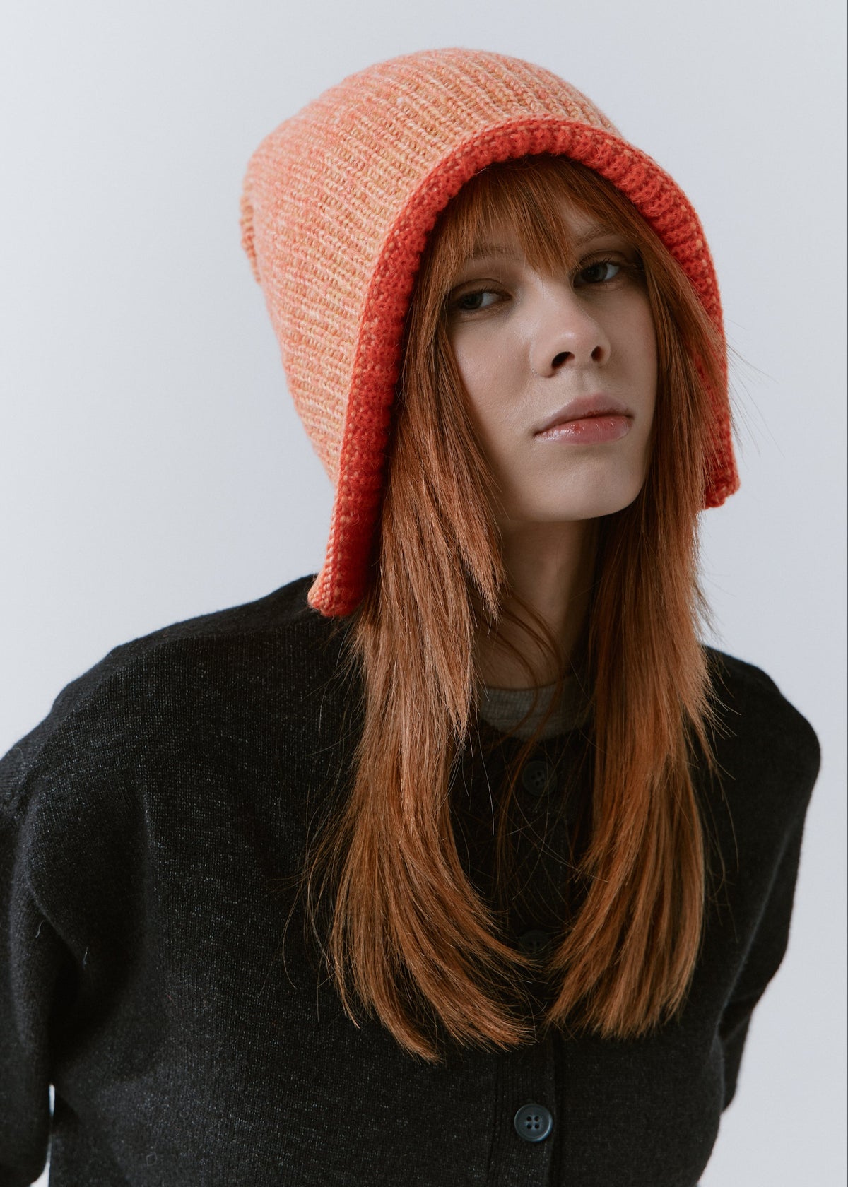 Lisse Orange & Red reversible wool beanie: Front view with the brim worn down