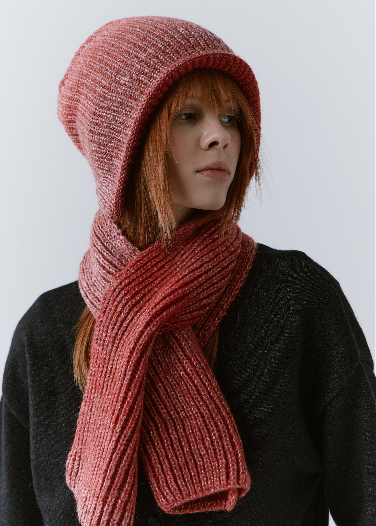 BRIKOLY Lisse Cherry ribbed knit scarf shown close up around a model's neck.