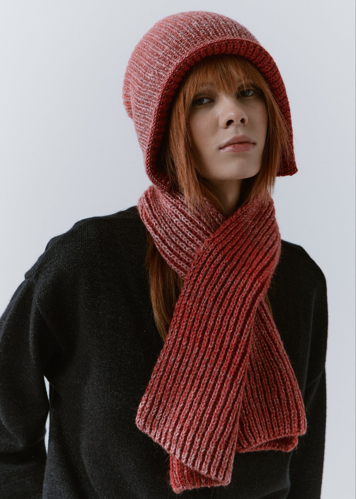 BRIKOLY Lisse Cherry ribbed knit scarf secured around a model's neck in a front view.