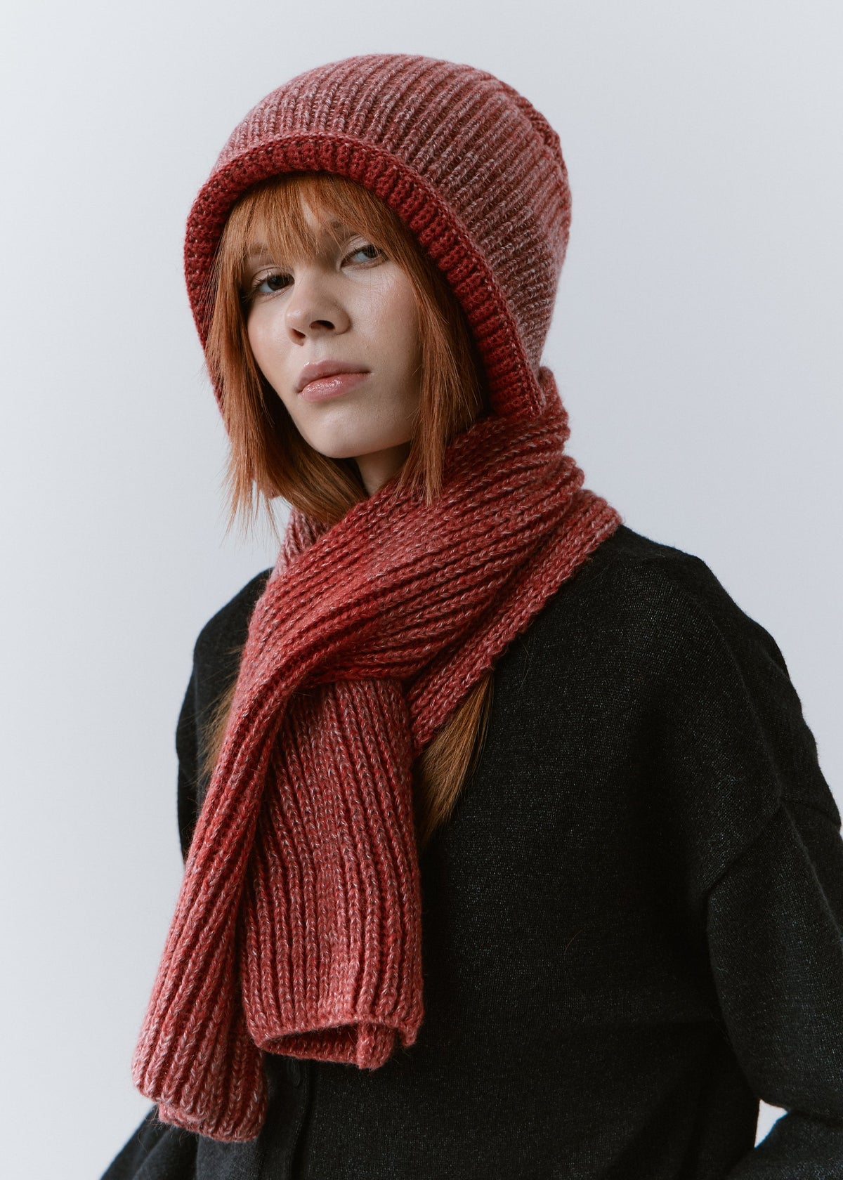 BRIKOLY Lisse Cherry ribbed knit scarf worn by a model with a matching beanie.