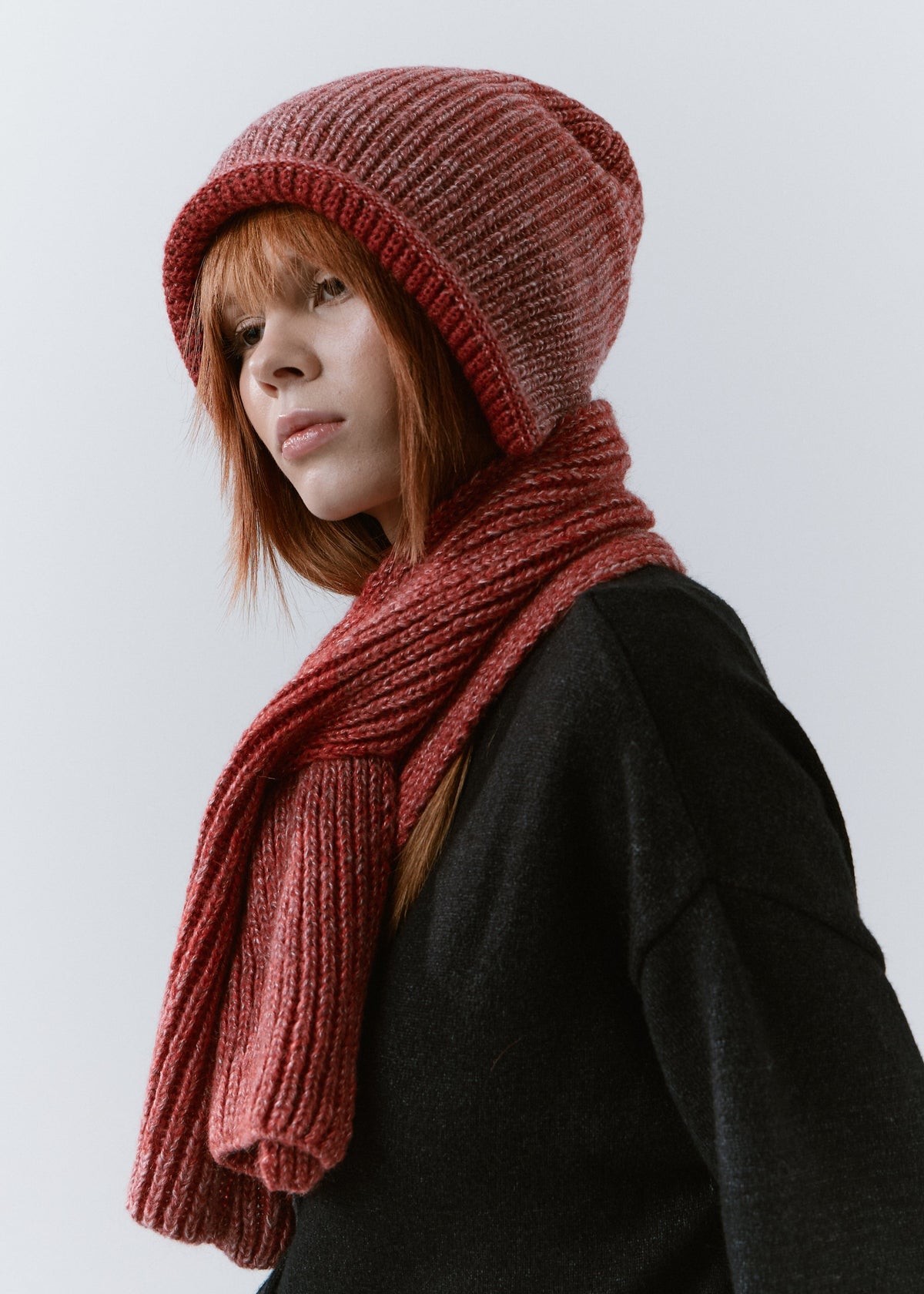BRIKOLY Lisse Cherry ribbed knit scarf shown in profile with the front end hanging down.