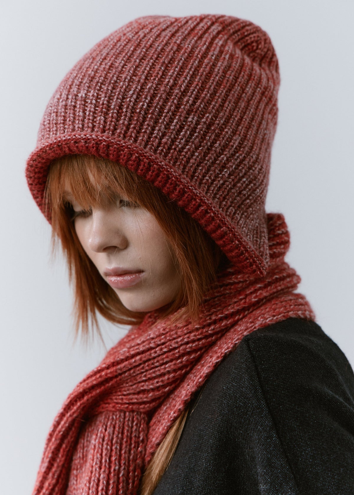 BRIKOLY Lisse Cherry ribbed knit scarf worn by a model looking down.