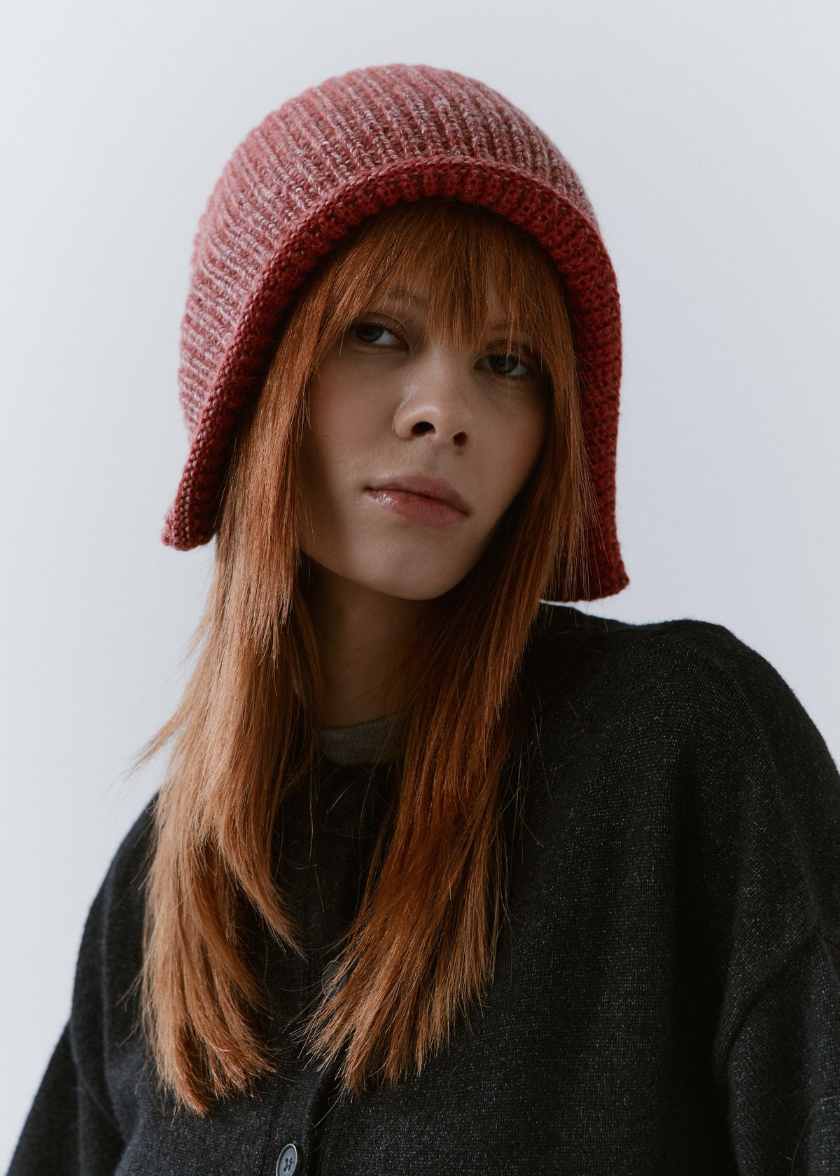 BRIKOLY Lisse Cherry reversible ribbed knit beanie shown in a close front view on a model.