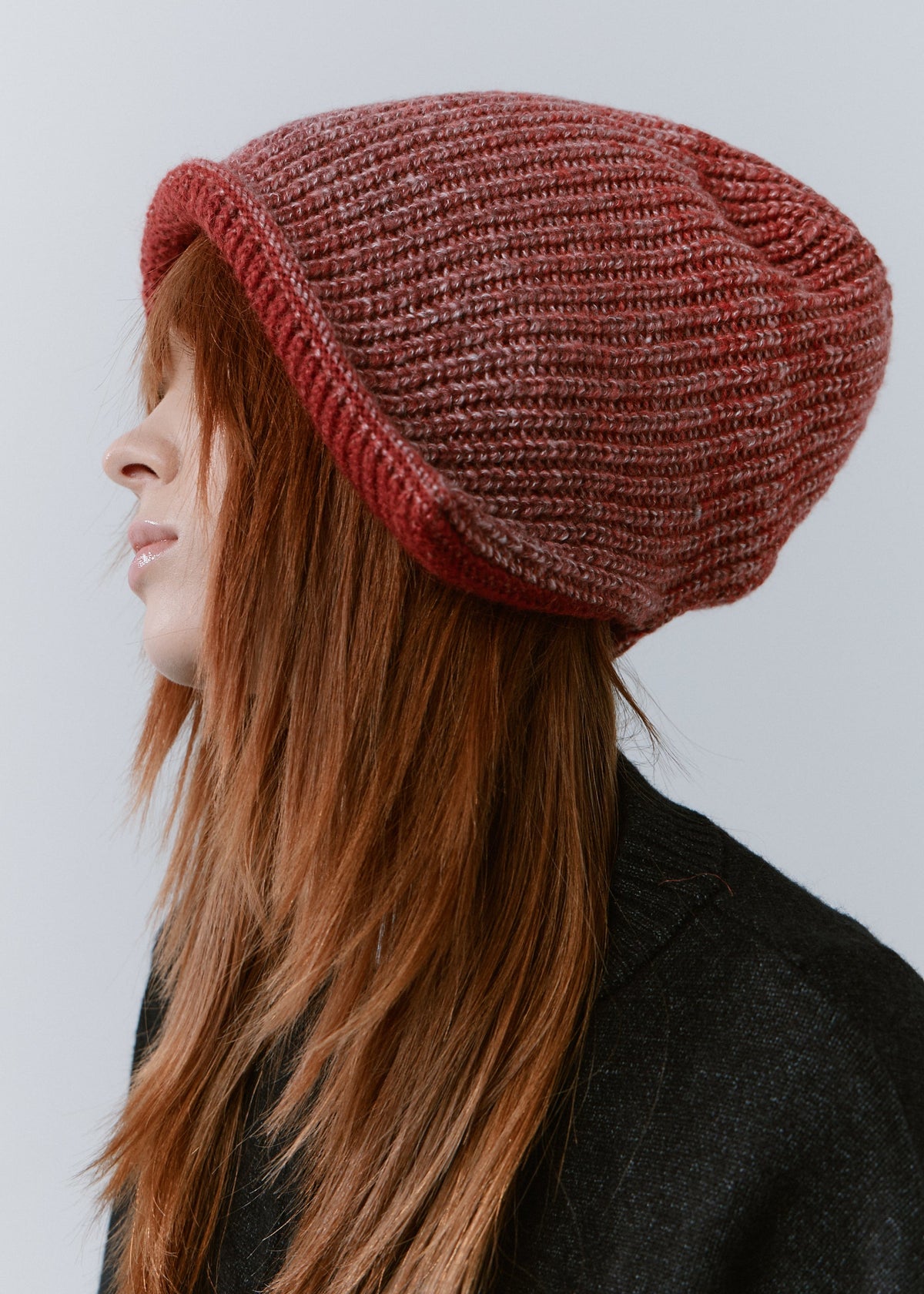 BRIKOLY Lisse Cherry reversible ribbed knit beanie shown in profile to reveal the relaxed crown.