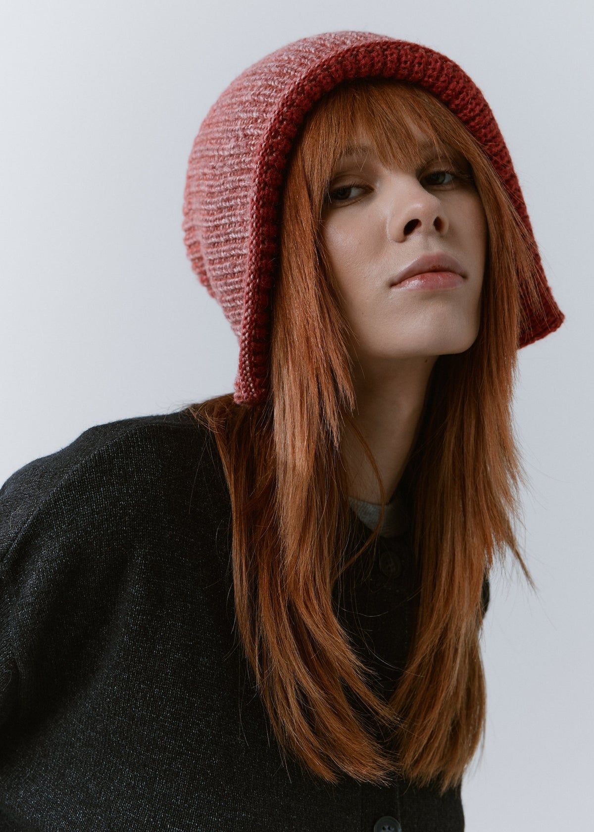 BRIKOLY Lisse Cherry reversible ribbed knit beanie shown in a close three-quarter view on a model.