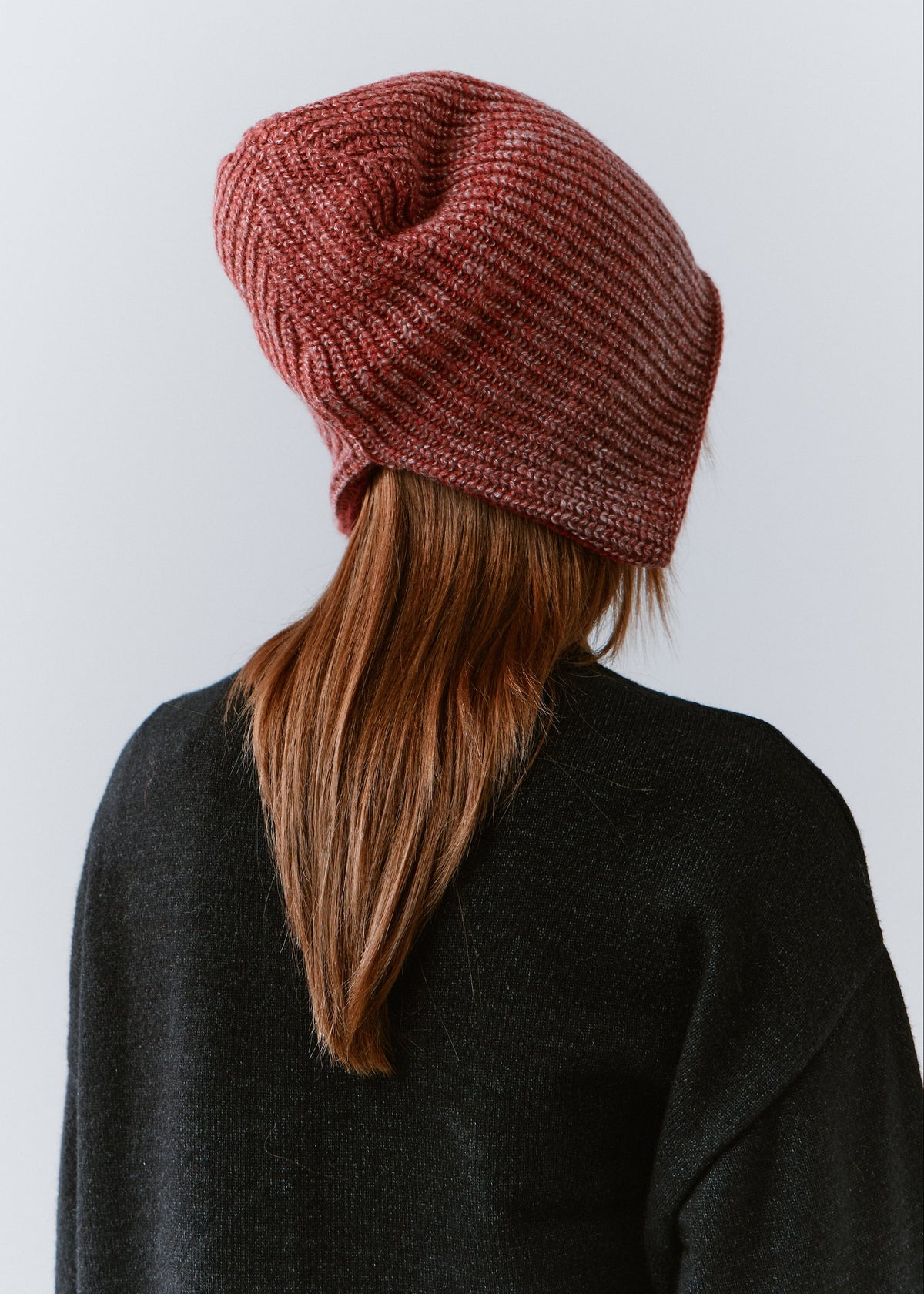BRIKOLY Lisse Cherry reversible ribbed knit beanie shown from the back to reveal the knit crown.