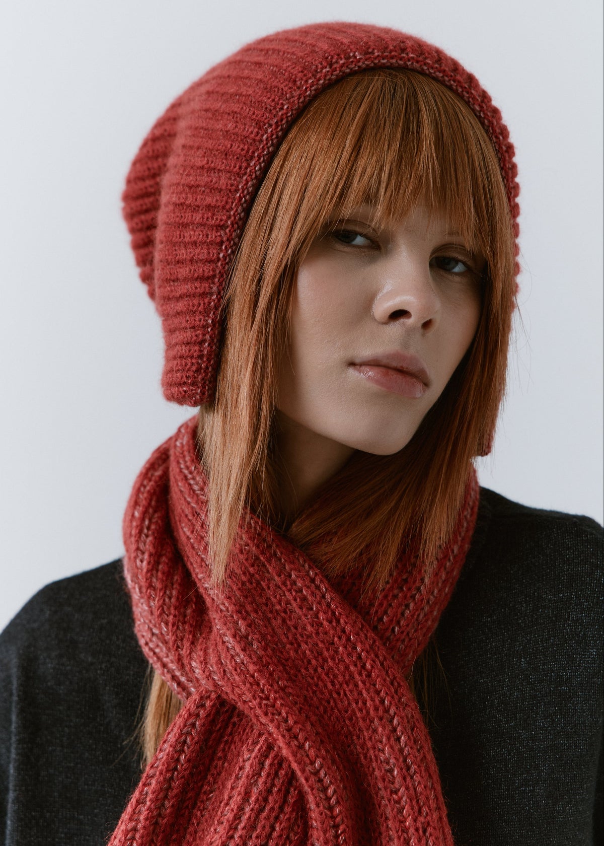 BRIKOLY Lisse Cherry ribbed knit scarf shown in a close front view on a model.