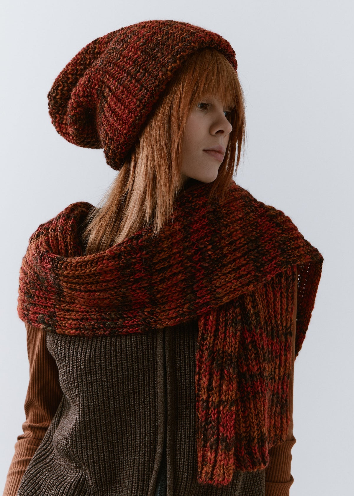 London Brown knit beanie: Side portrait with matching scarf, sold separately