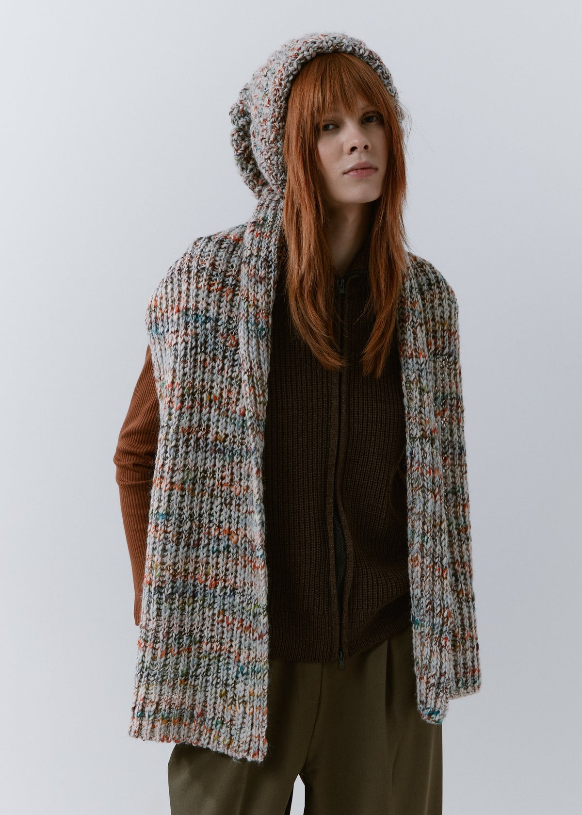 BRIKOLY FAN multicolor ribbed knit scarf worn unwrapped, with both ends hanging down the front on a model.
