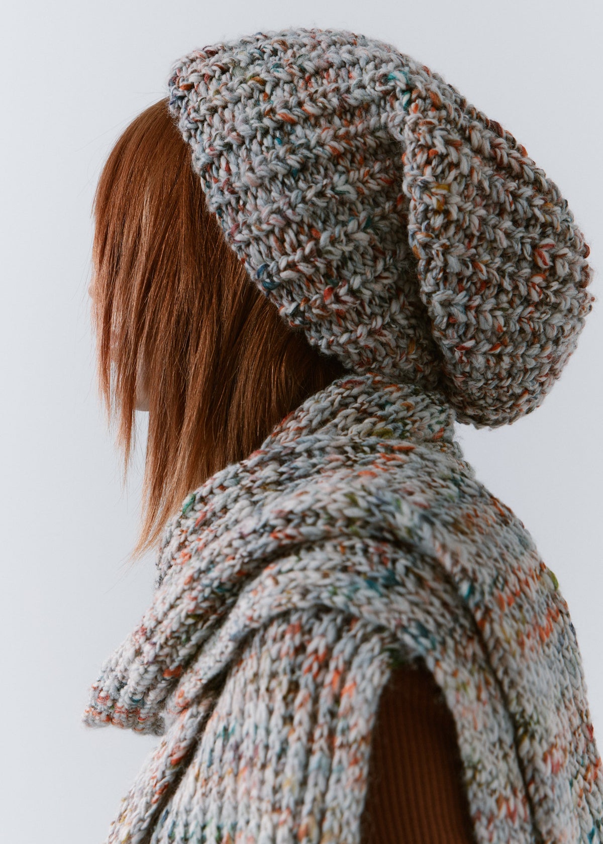 BRIKOLY FAN oversized multicolor knit beanie shown in a rear side view with a matching scarf.