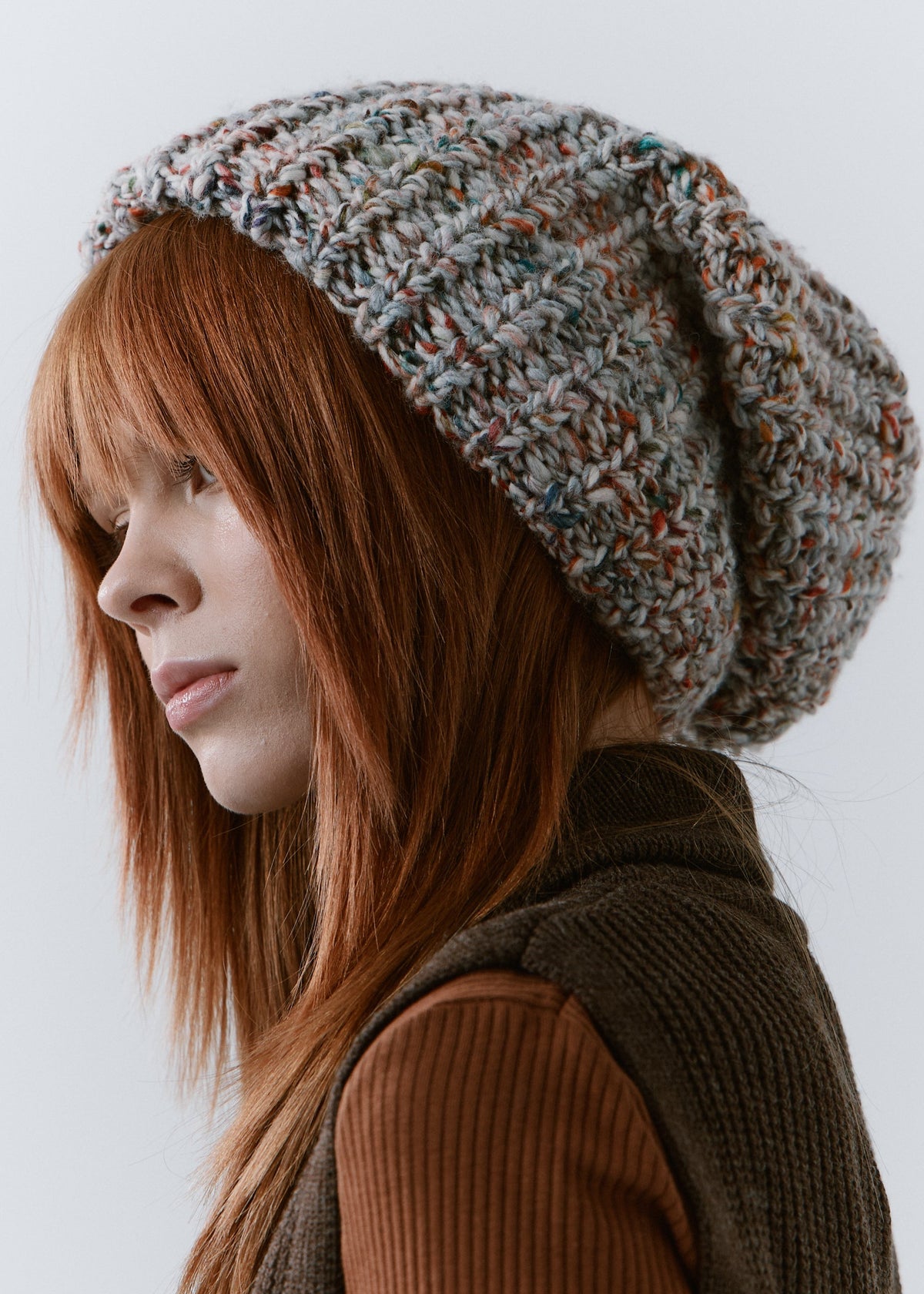 BRIKOLY FAN oversized multicolor knit beanie shown in profile with a relaxed slouchy crown.