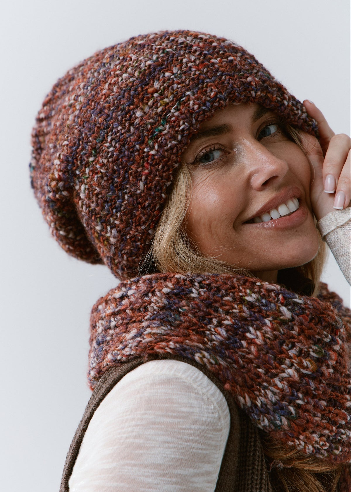 London Eggplant knit beanie: Three-quarter portrait with matching scarf, sold separately