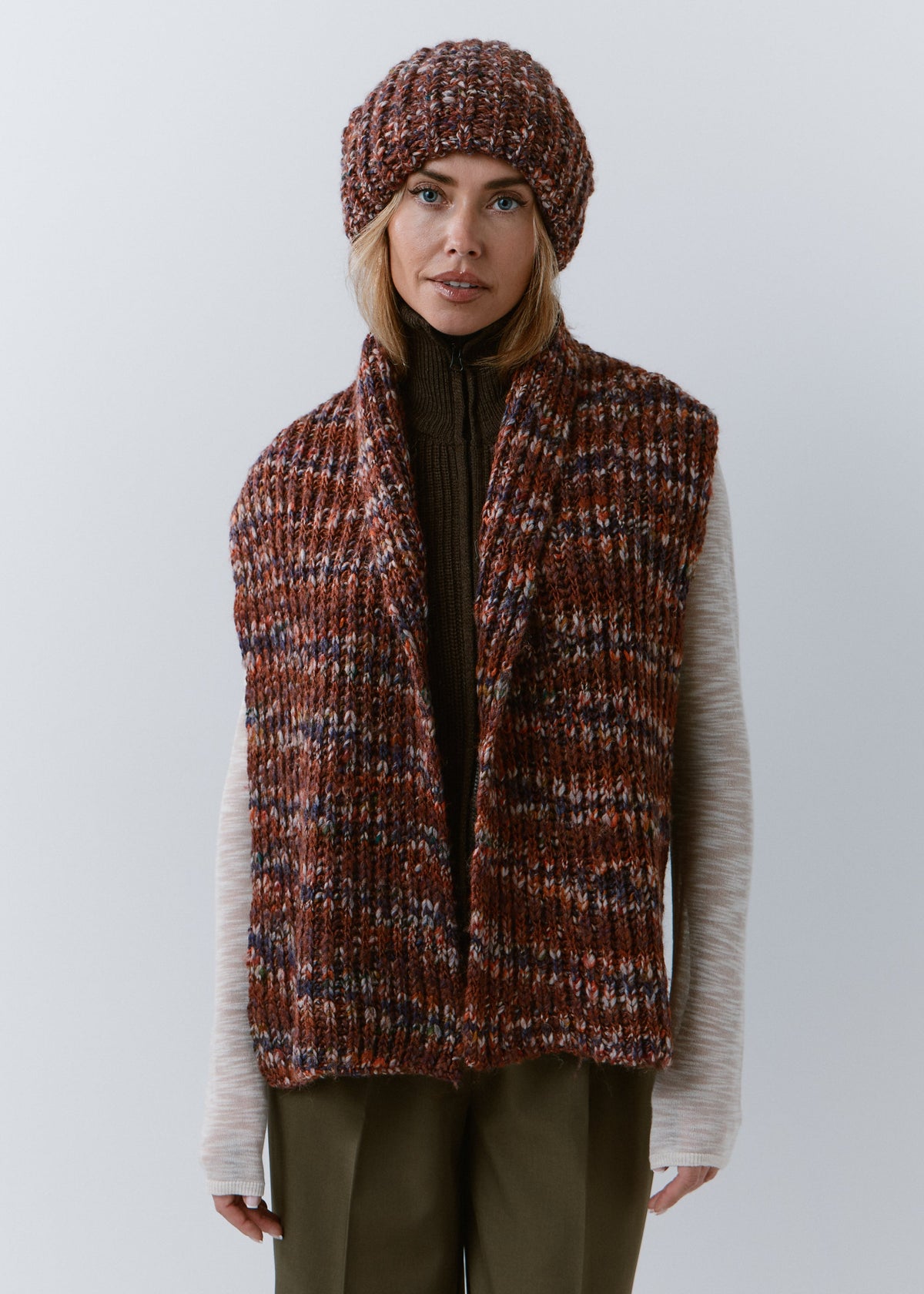 BRIKOLY Eggplant multicolor ribbed knit scarf worn unwrapped by a model with both ends hanging down the front.