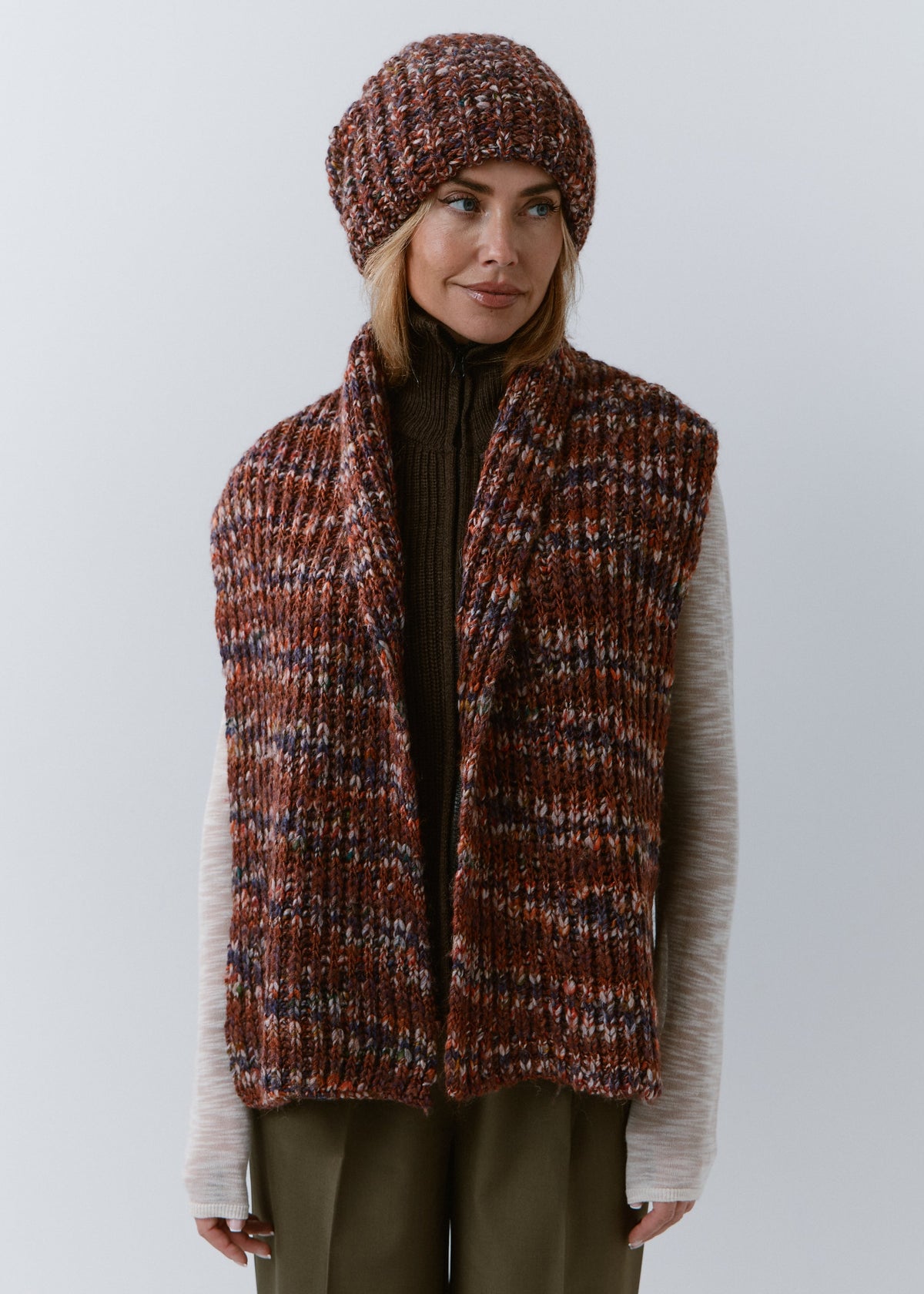 BRIKOLY Eggplant multicolor ribbed knit scarf draped over a model's shoulders with both ends hanging in front.