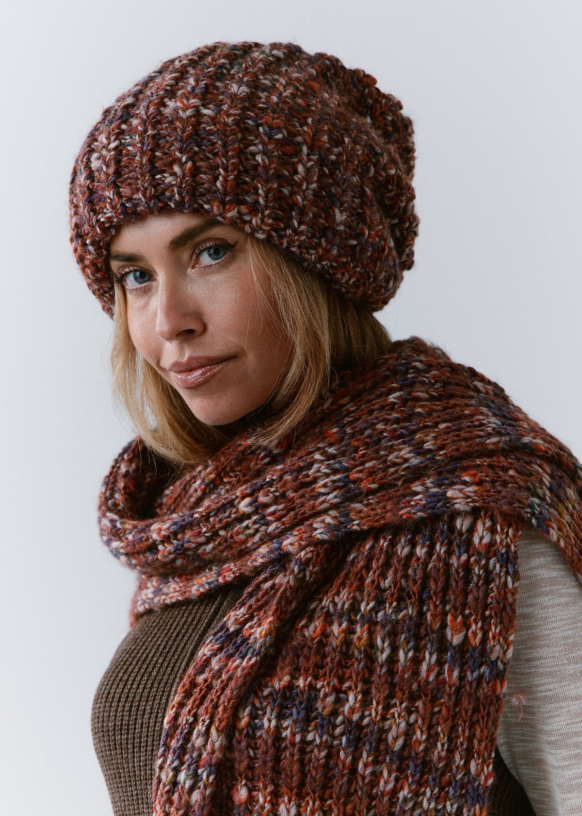 BRIKOLY Eggplant oversized multicolor knit beanie worn by a model in a three-quarter view.