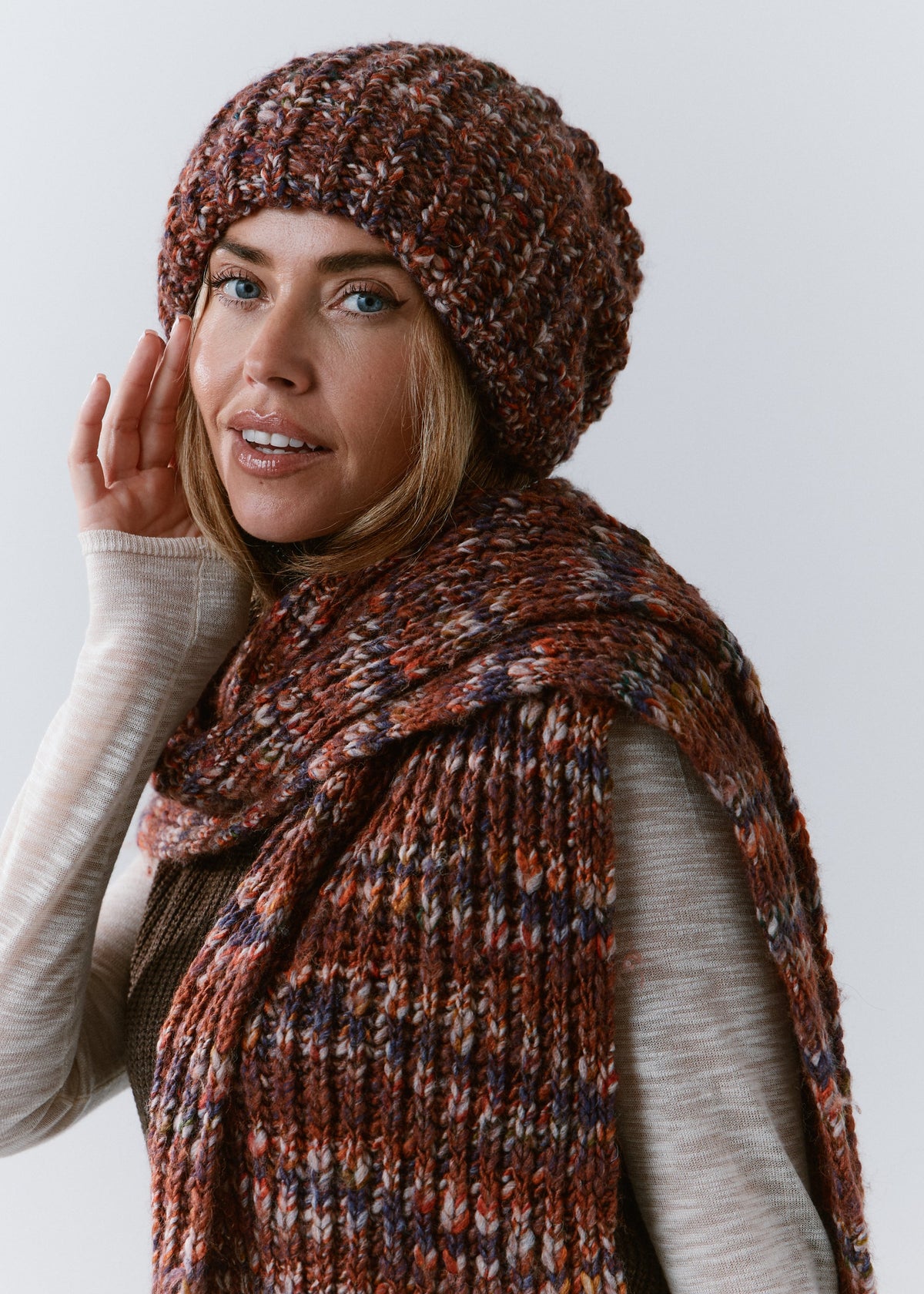 BRIKOLY Eggplant oversized multicolor knit beanie shown in a side view on a model with a matching scarf.