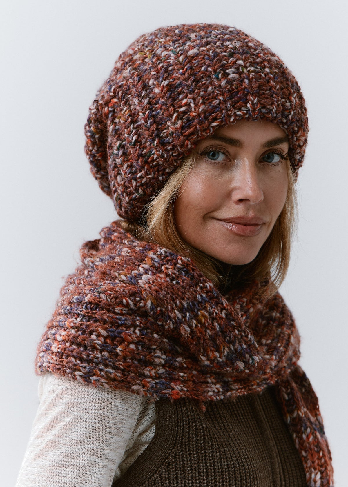 BRIKOLY Eggplant oversized multicolor knit beanie shown from the side to reveal its rounded slouchy crown.