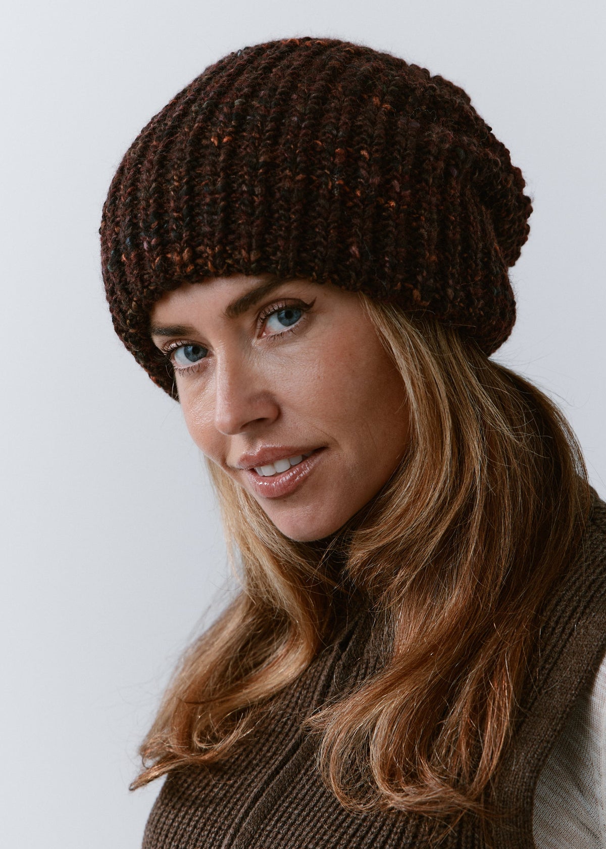 London Burgundy and Black knit beanie: Front three-quarter close-up