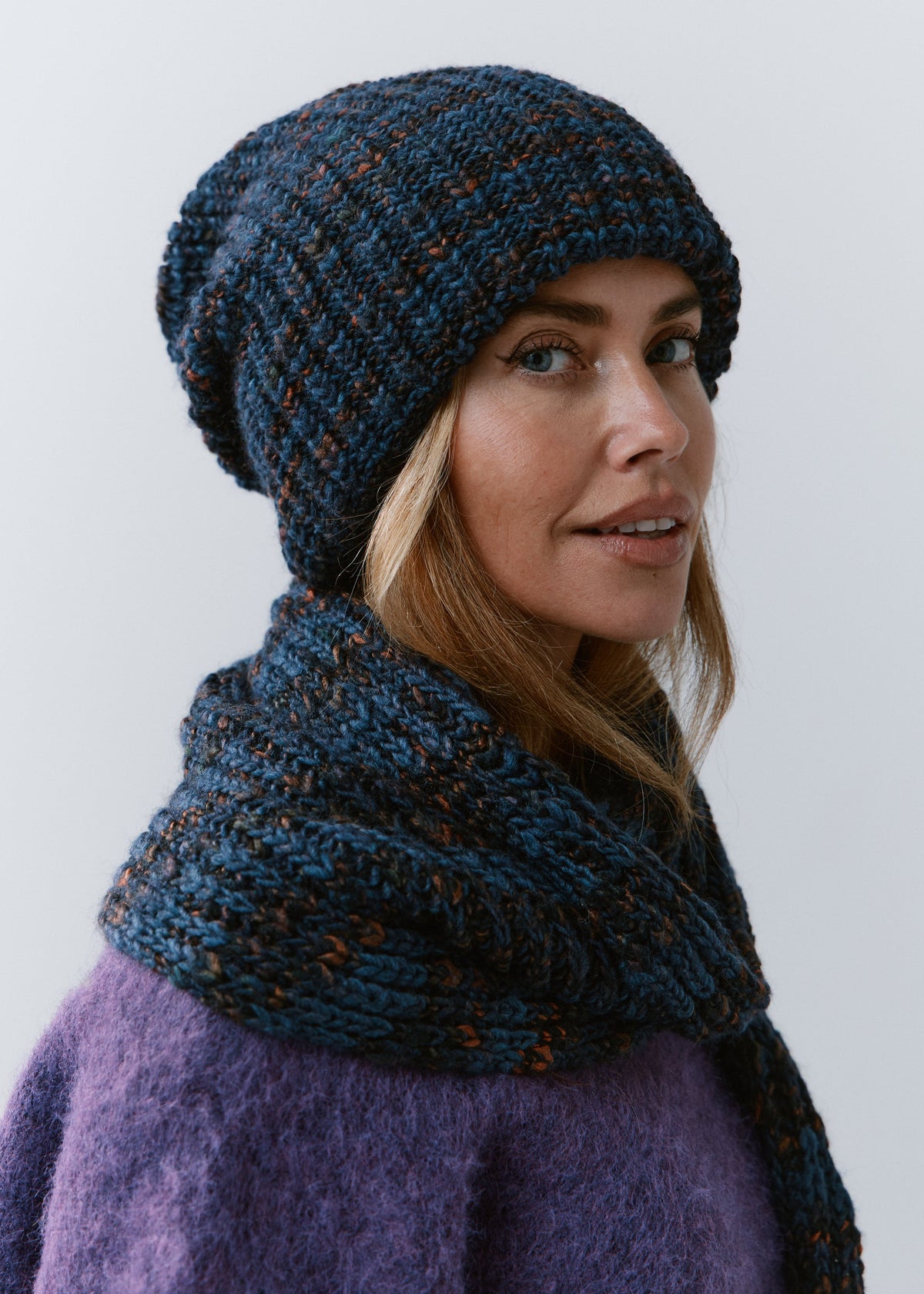 London Dark Lavender knit beanie: Three-quarter portrait with matching scarf, sold separately