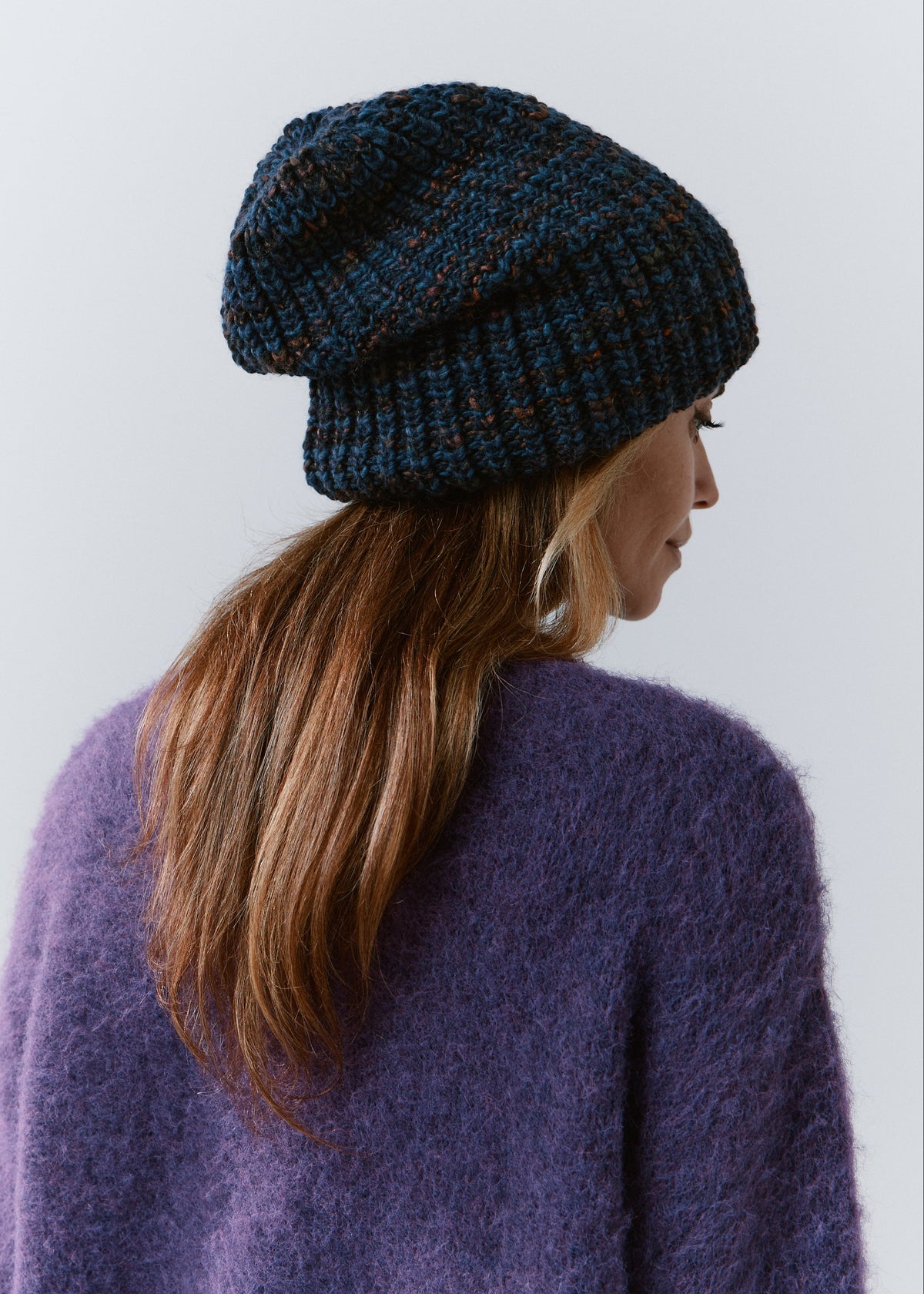 London Dark Lavender knit beanie: Rear side view of the relaxed crown