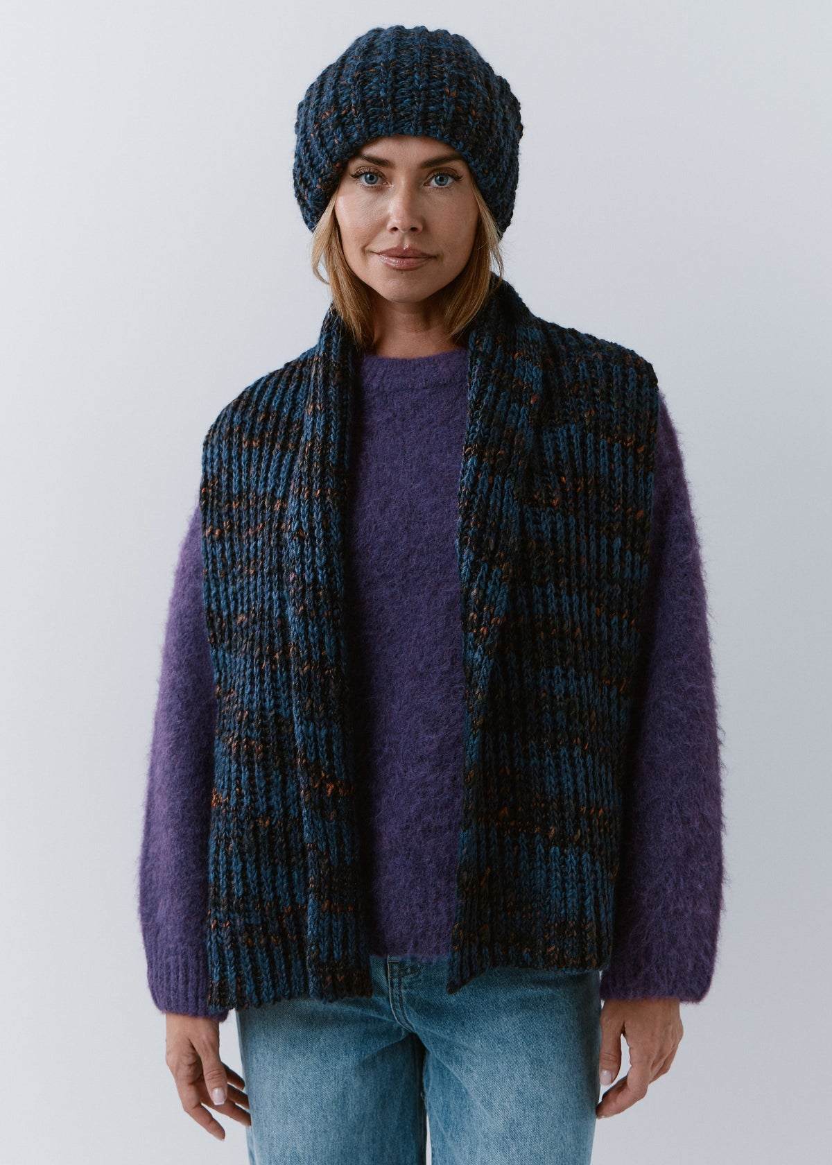 BRIKOLY Dark Lavender oversized knit beanie worn by a model with a matching scarf hanging down the front.